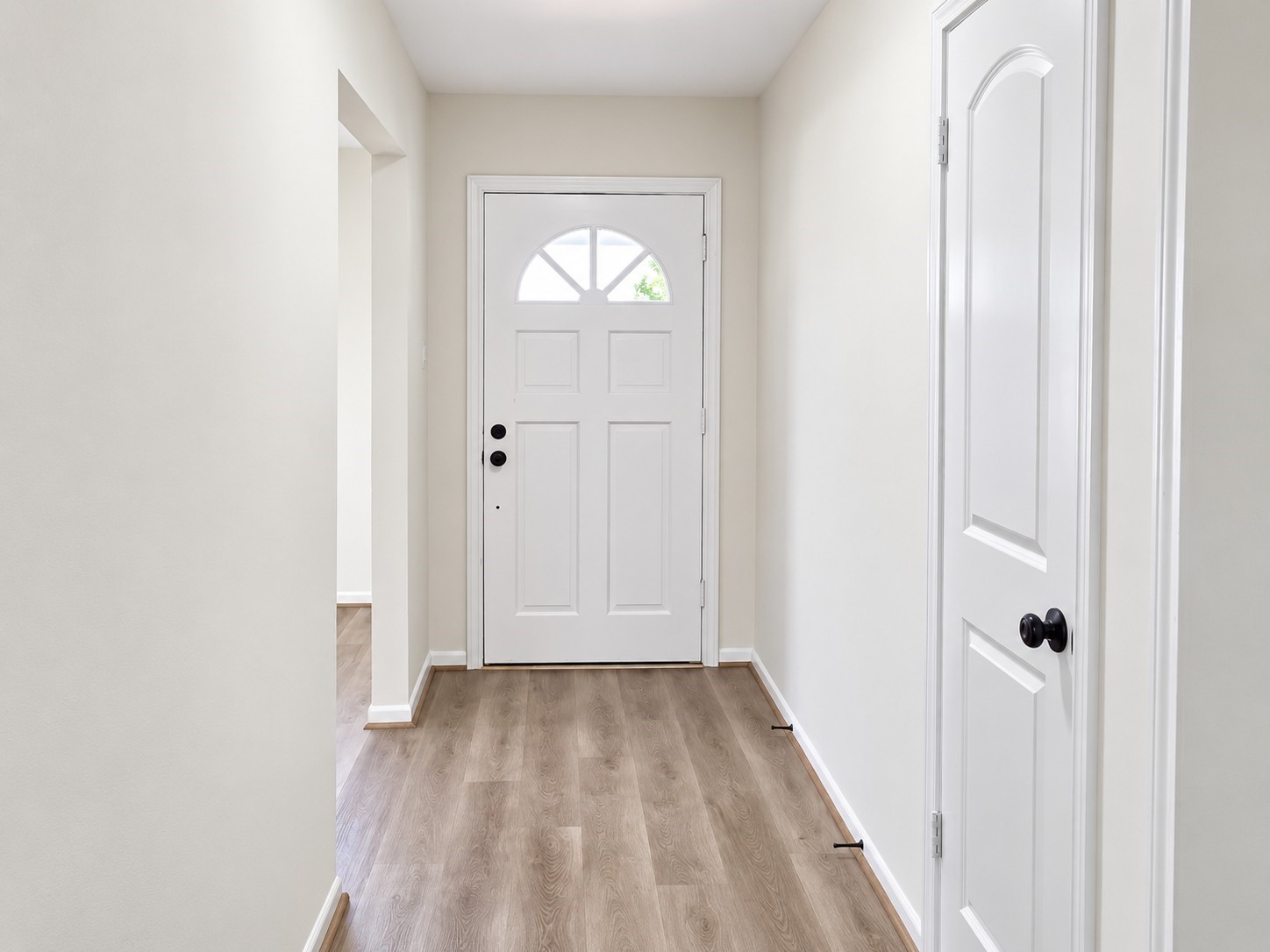 Bright front entry with updated wood-look flooring and an easy flow into the main living spaces. Bright front entry with updated wood-look flooring and an easy flow into the main living spaces.
