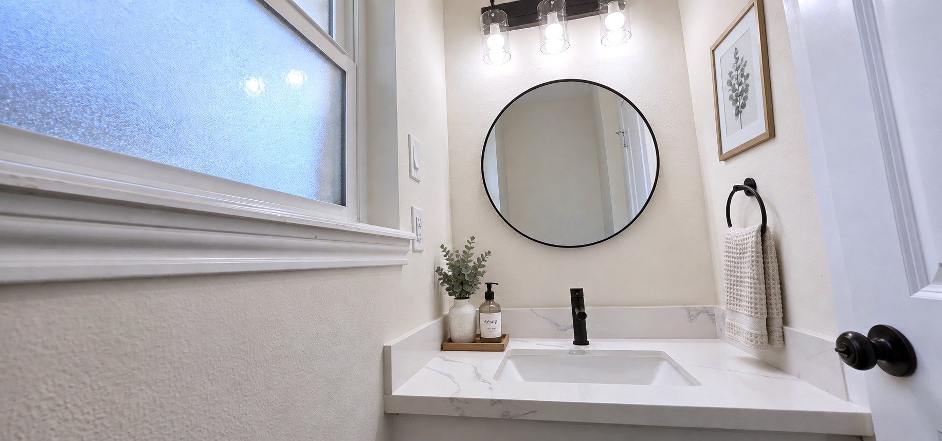 Virtually staged: Powder room styled with understated dcor to showcase its crisp, modern finishes.