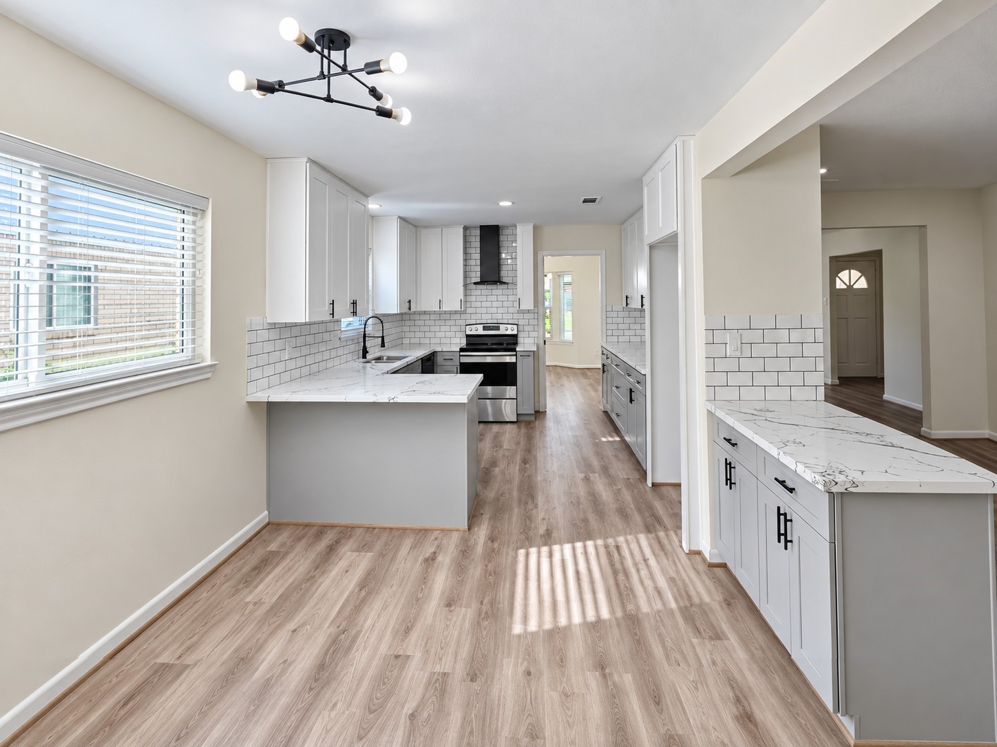 Bright breakfast area opens directly to the kitchen for an effortless flow between dining and meal preparation.