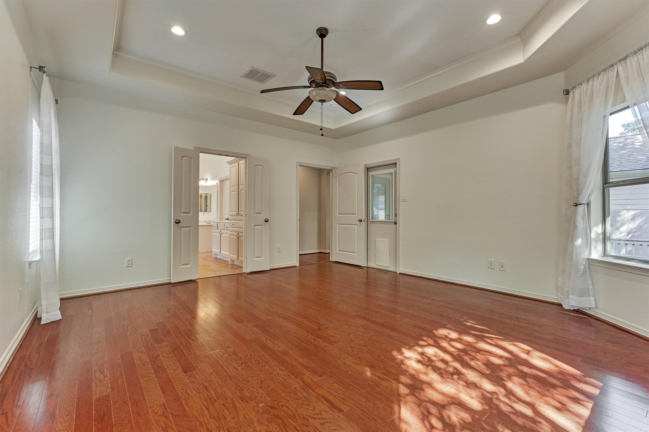 An ensuite bath and door leading to the sunroom complete this space.