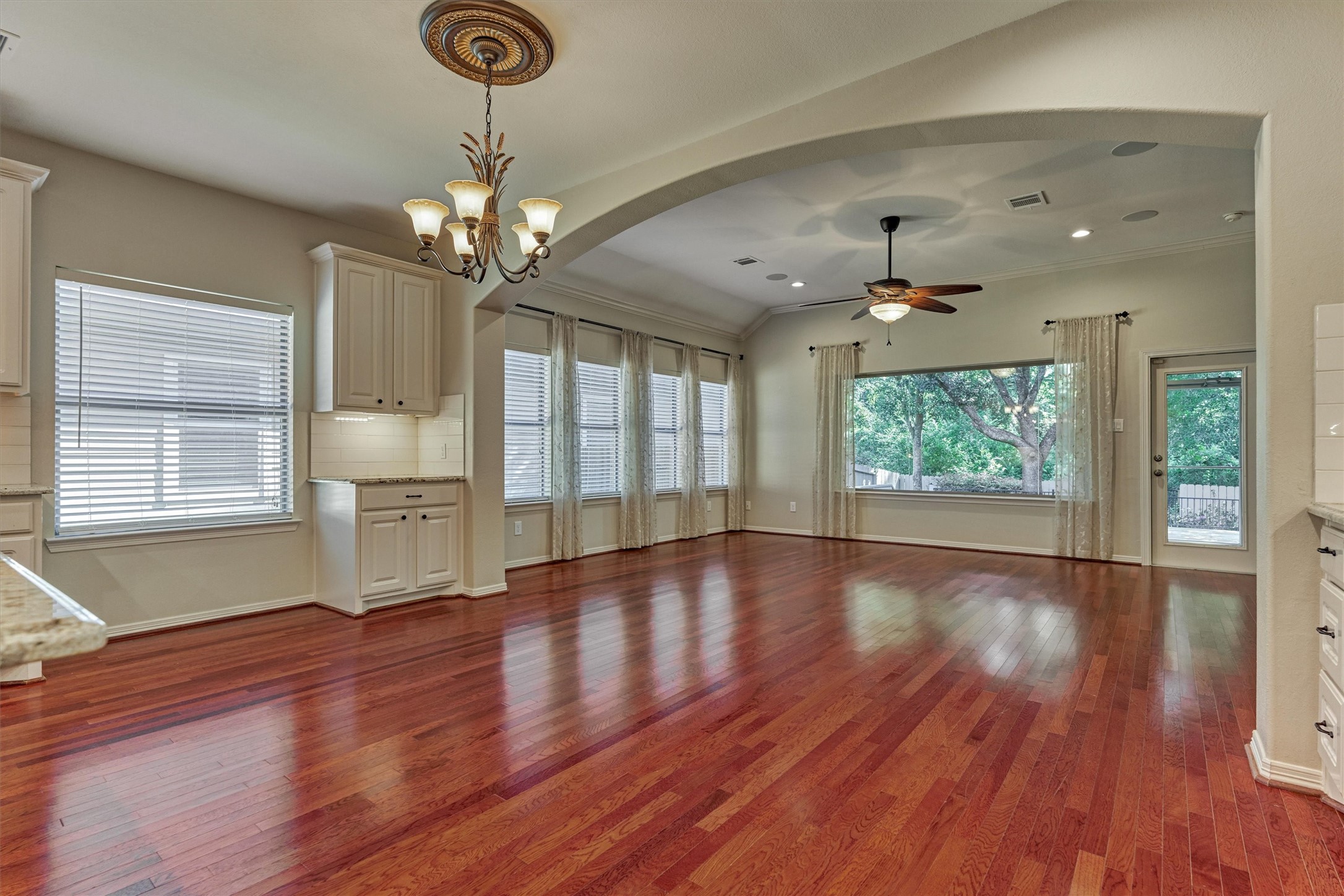 Dining area is anchored by built-ins for storage and decorative pendant lighting. Dining area is anchored by built-ins for storage and decorative pendant lighting.