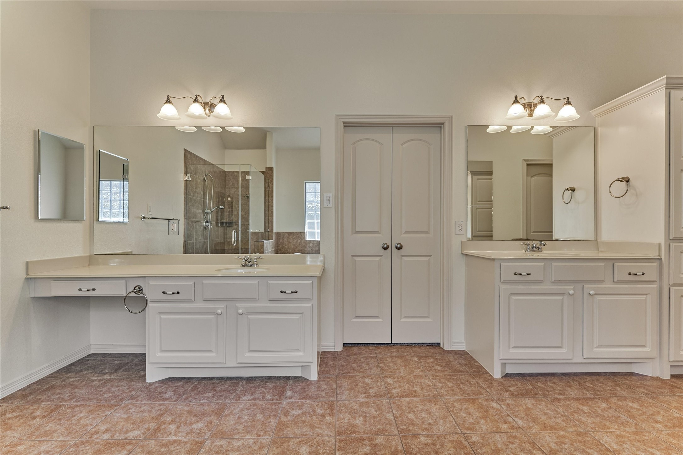 Double sinks, vanity area, built-ins and even two closets!