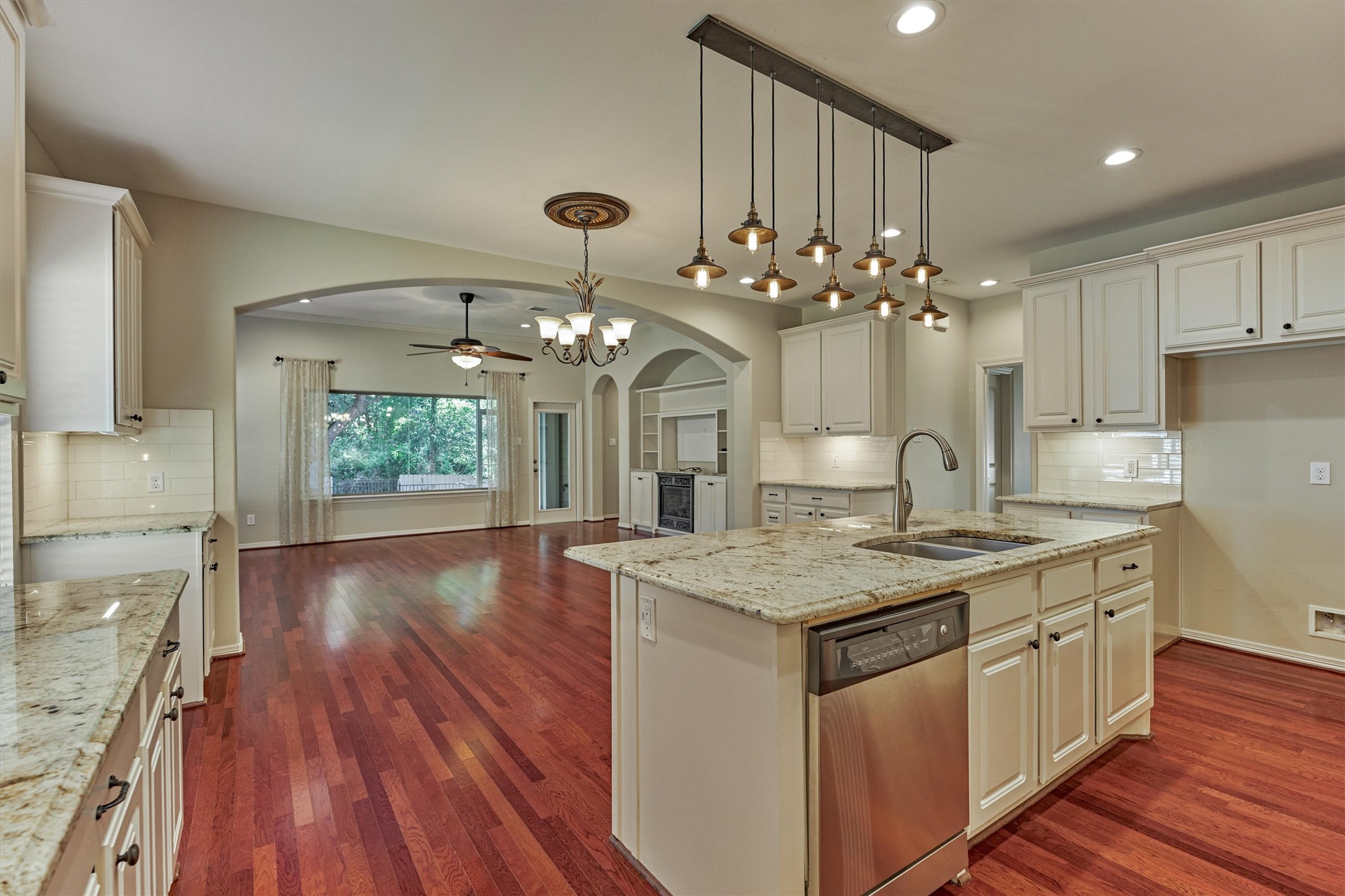 A look back to the dining and living rooms from the kitchen. The open concept floor plan is great for entertaining!
