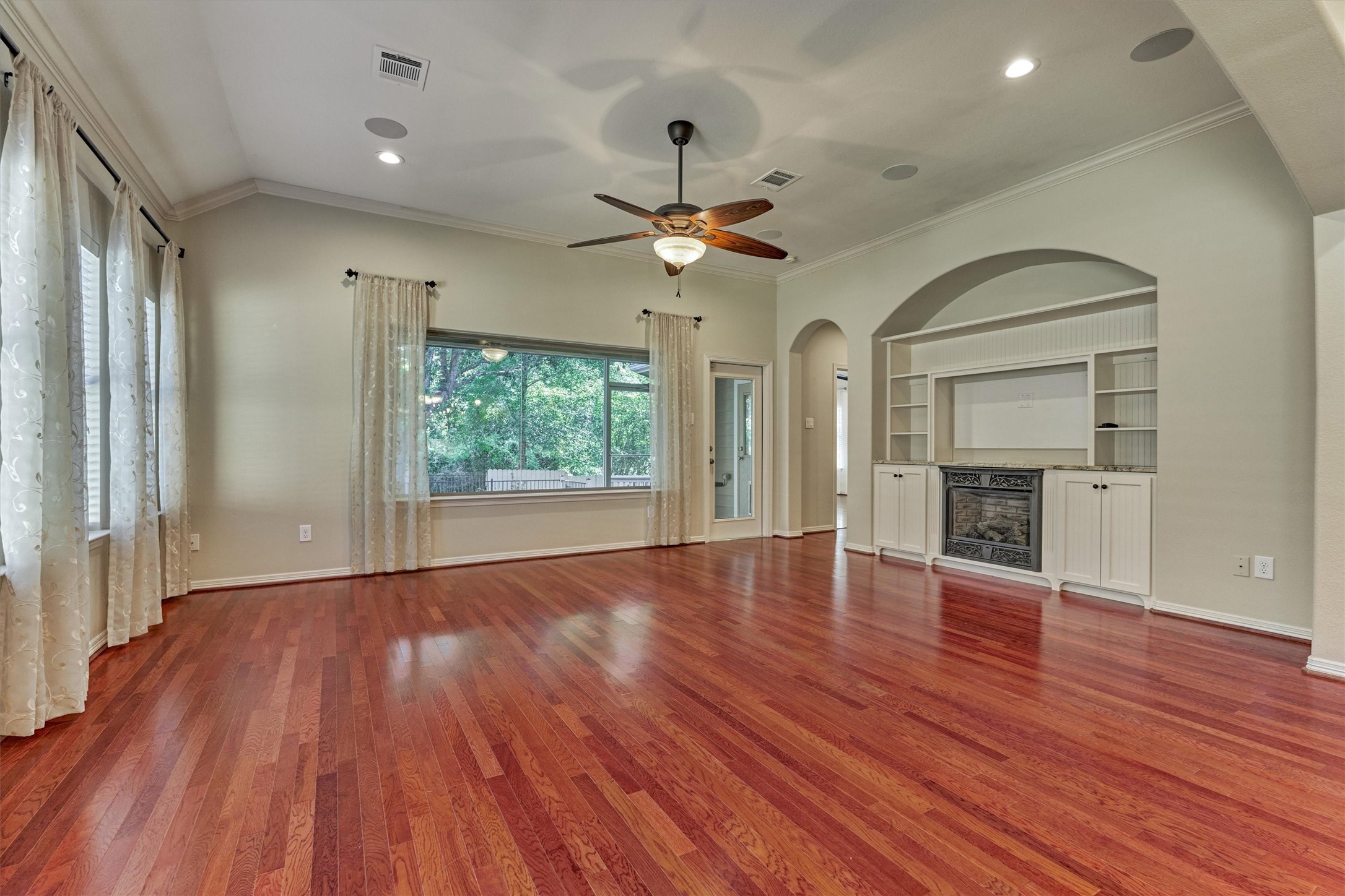 Built-ins and electric fireplace are the focal point of this room.
