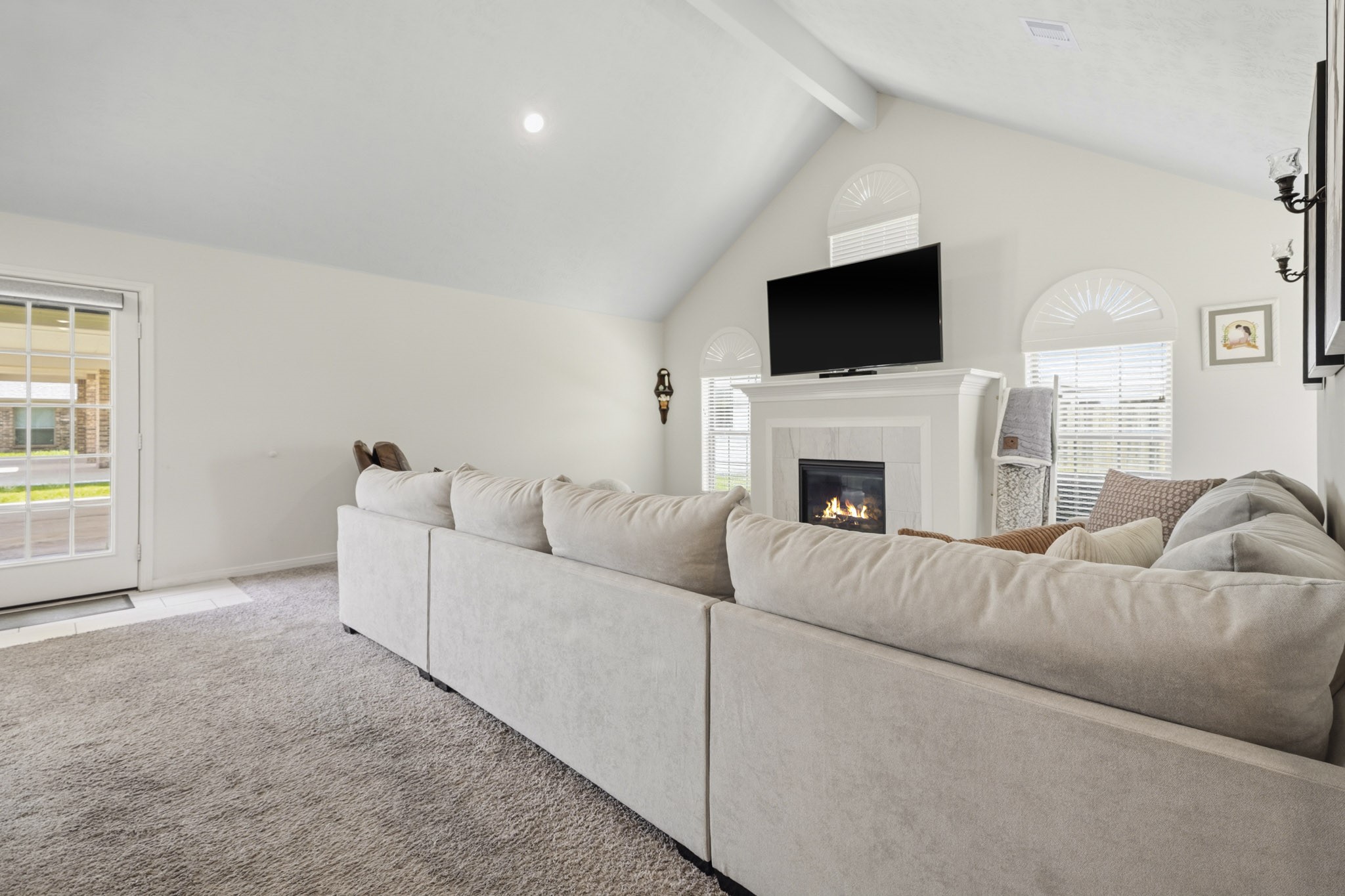 Vaulted ceilings in living area with an abundance of natural light.