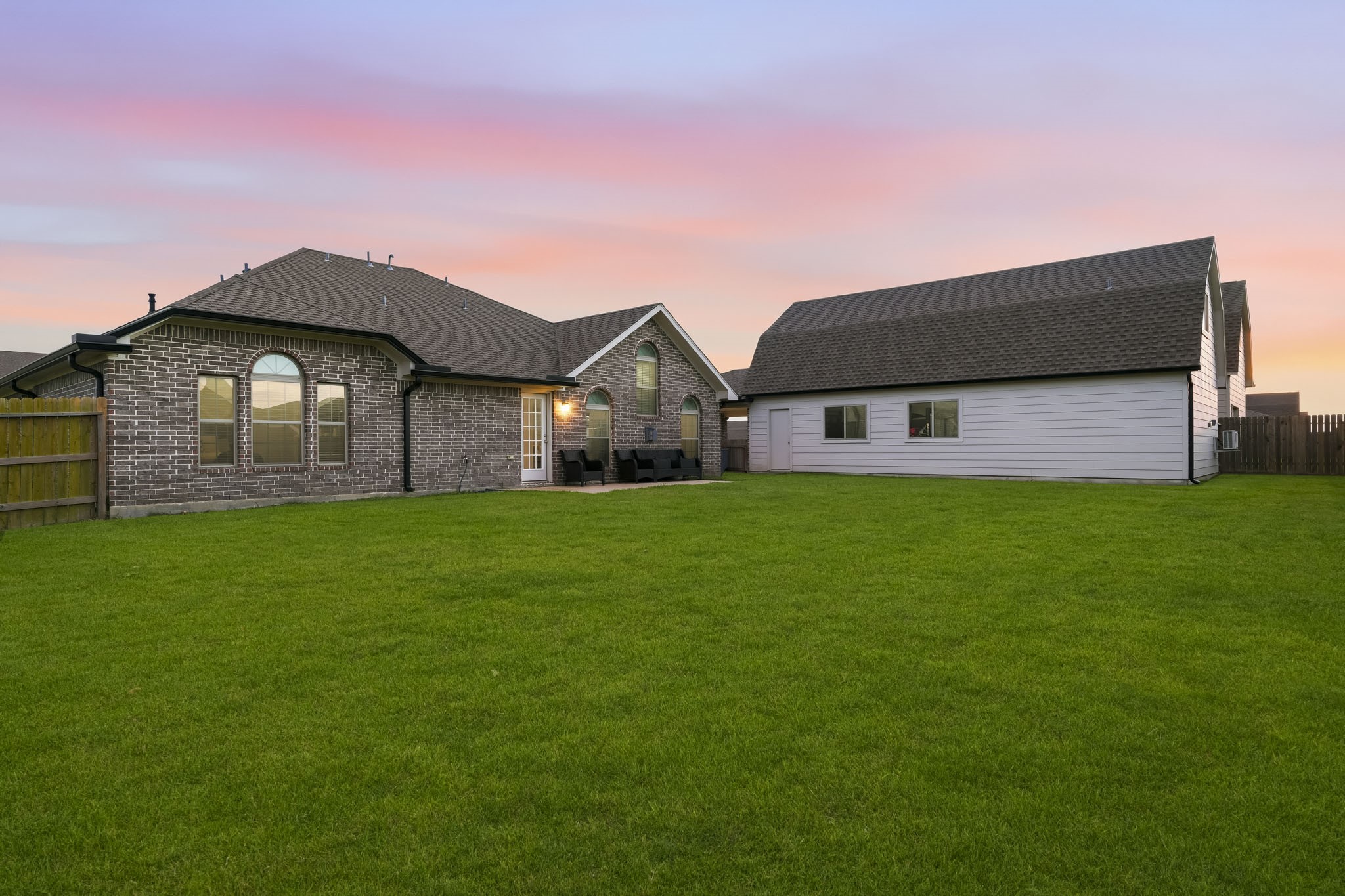 Large back yard with enough space for patio and pool, view with added sod 1.