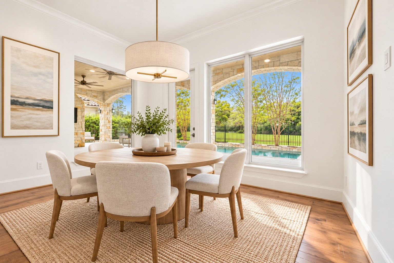 This inviting dining space offers room to gather for everything from casual breakfasts to intimate dinners, with lovely views of the covered patio and surrounding greenery. *Virtually Staged