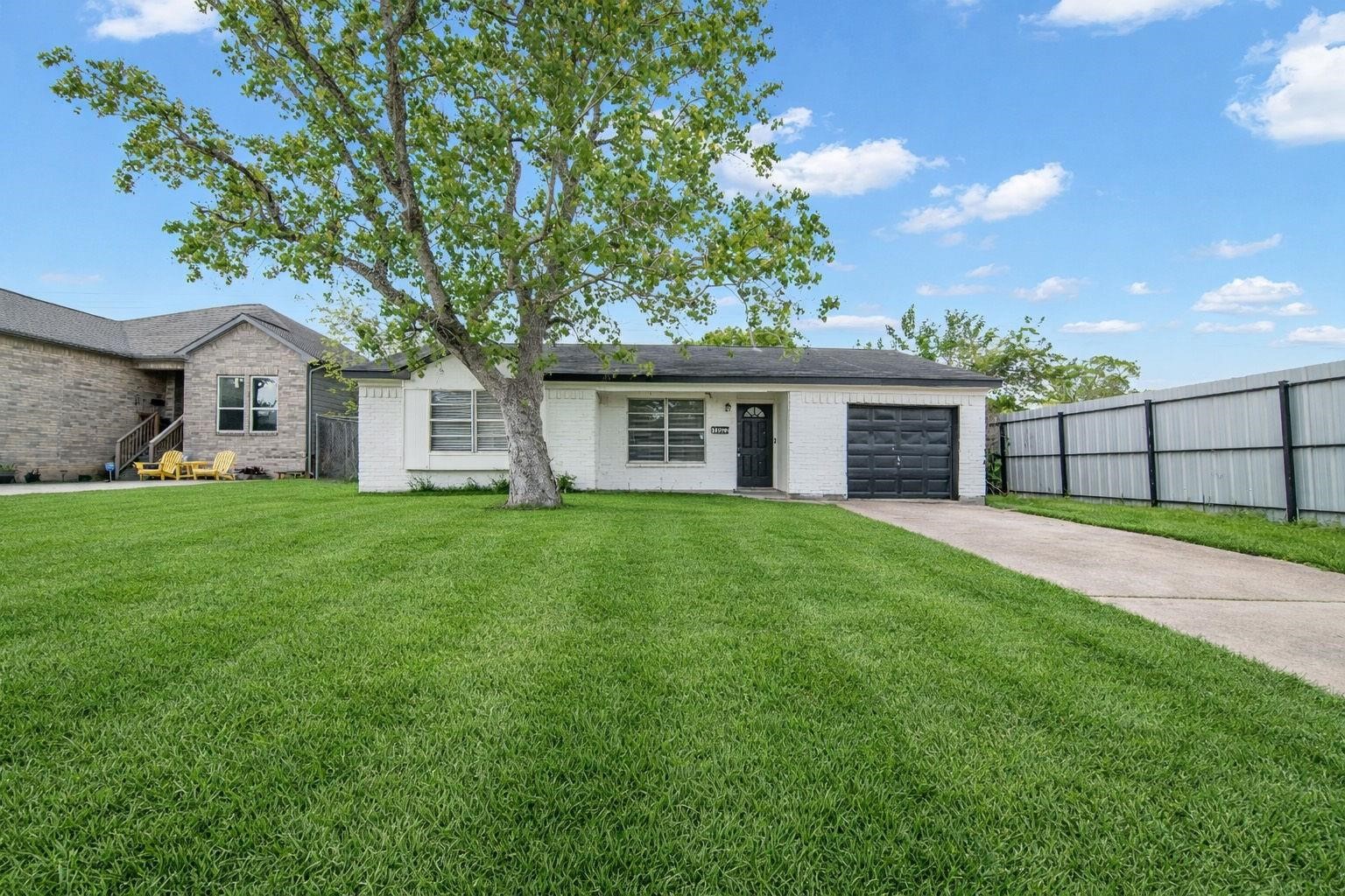 Beautifully situated on a tree-lined lot, this solid brick home offers an exceptional sense of privacy, with no neighboring homes directly behind or on one side. Mature trees create a picturesque setting, providing natural shade and a peaceful backdrop. A distinctive front door with starburst glass detailing and the timeless brick exterior offers lasting appeal. Beautifully situated on a tree-lined lot, this solid brick home offers an exceptional sense of privacy, with no neighboring homes directly behind or on one side. Mature trees create a picturesque setting, providing natural shade and a peaceful backdrop. A distinctive front door with starburst glass detailing and the timeless brick exterior offers lasting appeal.