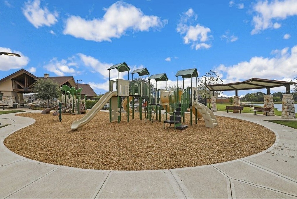 Vanbrookes community playground offers slides, climbing features, and nearby covered seating. Community amenitynot located on the subject property.