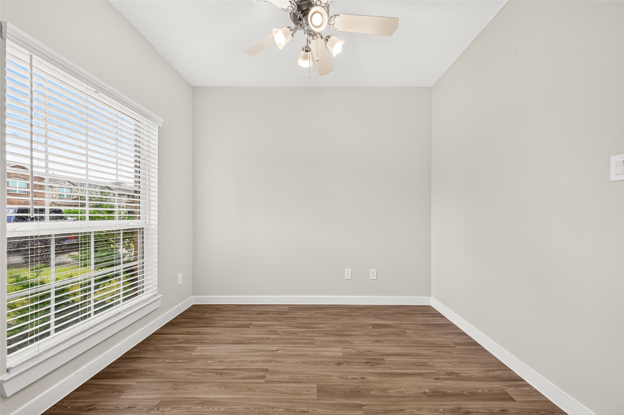 Natural light and wood-look flooring make the front study a comfortable, versatile space.