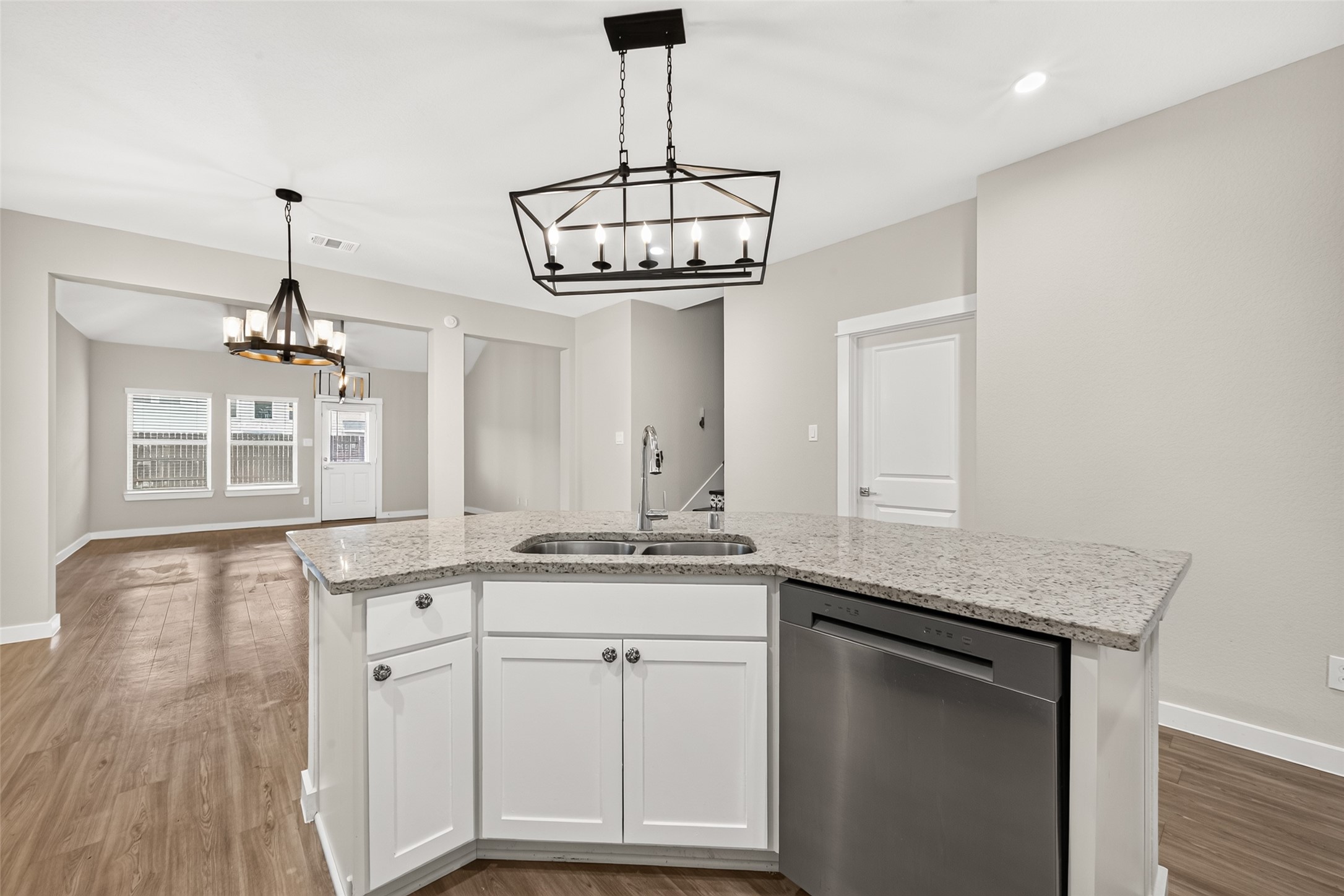 The kitchens breakfast bar overlooks the main living spaces, keeping the cook connected with guests.