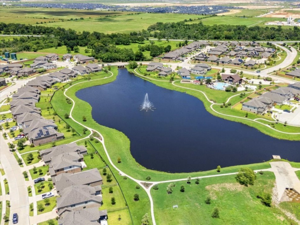 An aerial view highlights the lake and surrounding Vanbrooke neighborhood. Community photonot a view from the subject property.