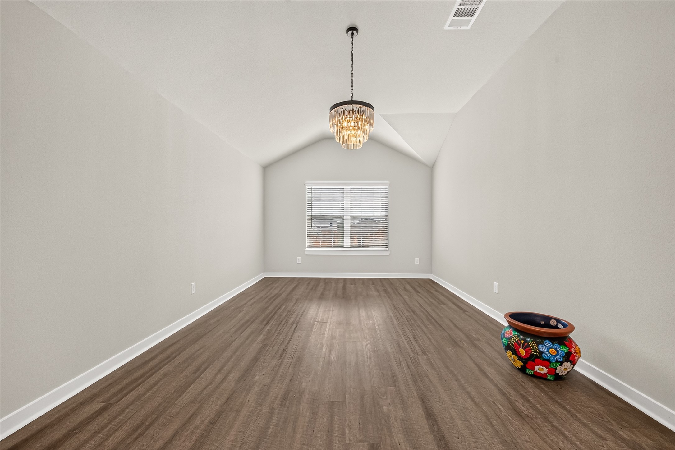 The spacious upstairs game room offers flexibility for a media area, game tables, or an additional lounge.