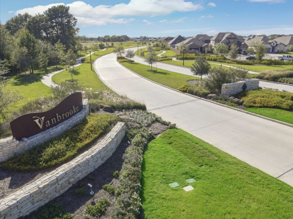 The landscaped entrance welcomes you to the Vanbrooke community. Community photo.