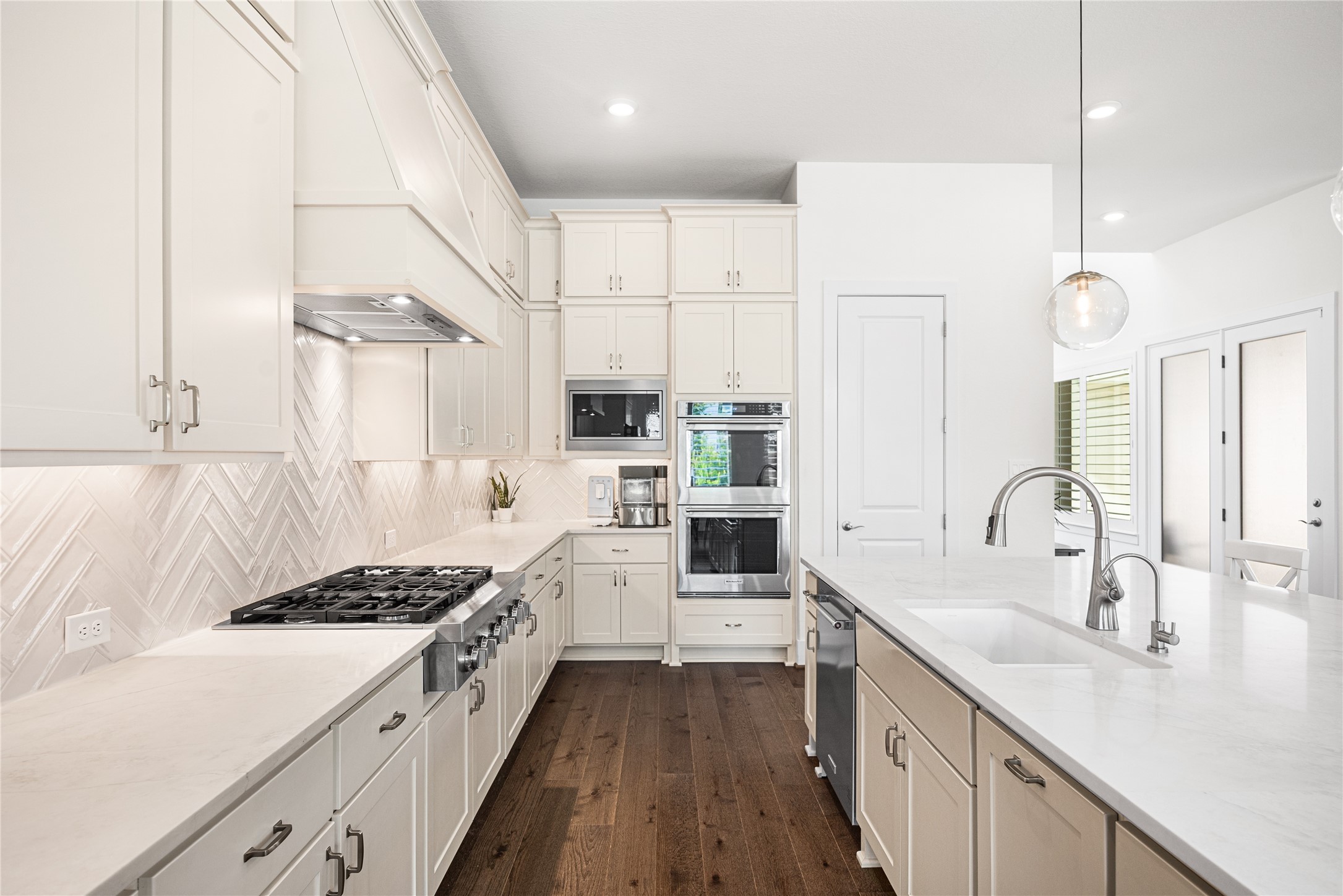 Generous cabinetry extends all the way to the ceiling, maximizing storage while enhancing both functionality and a polished, streamlined look.