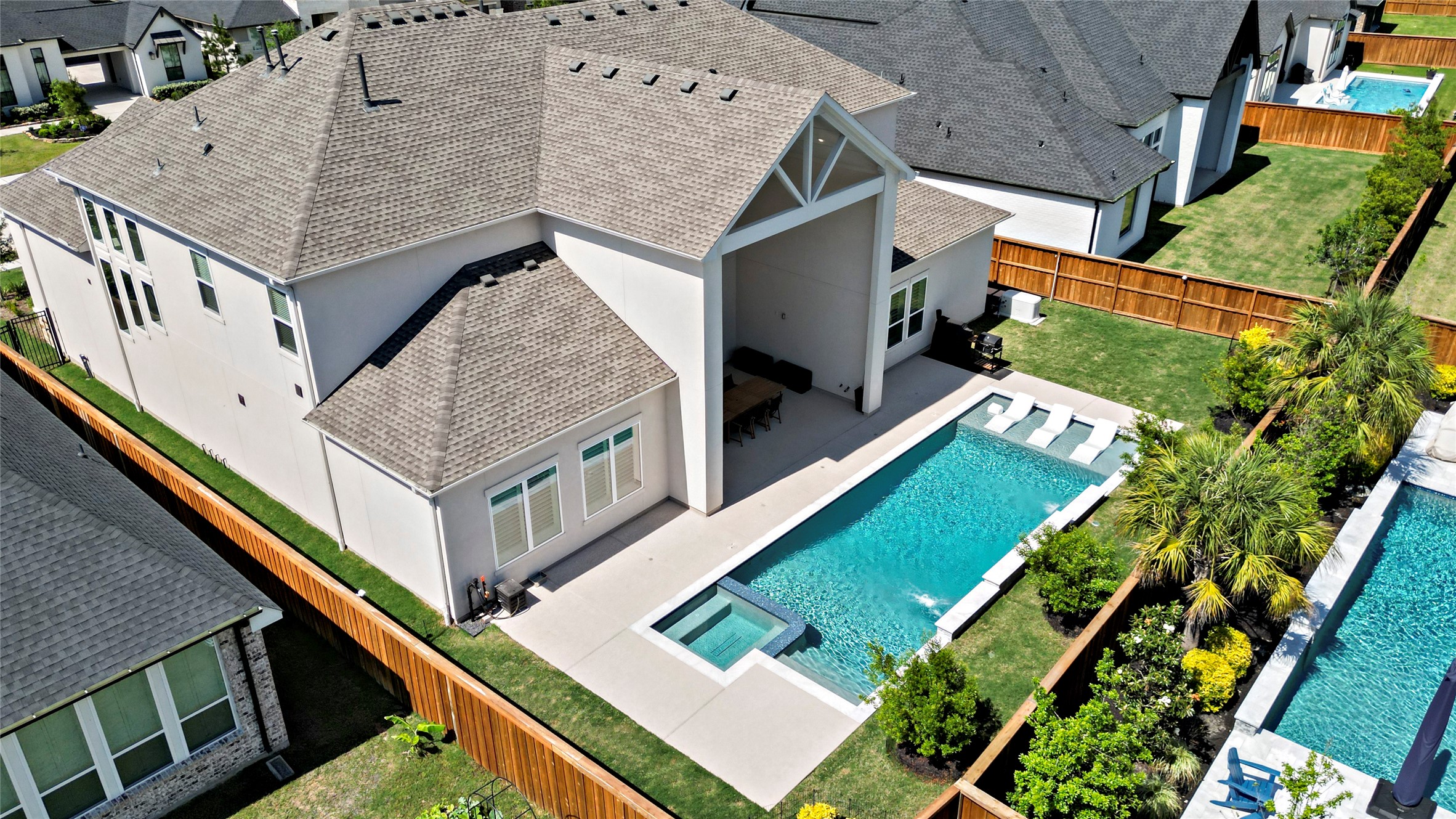 Aerial view of the pool and backyard.