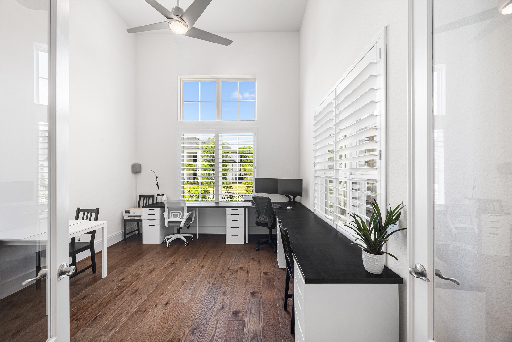 Study with soaring ceilings and large windows bringing in tons of natural light.