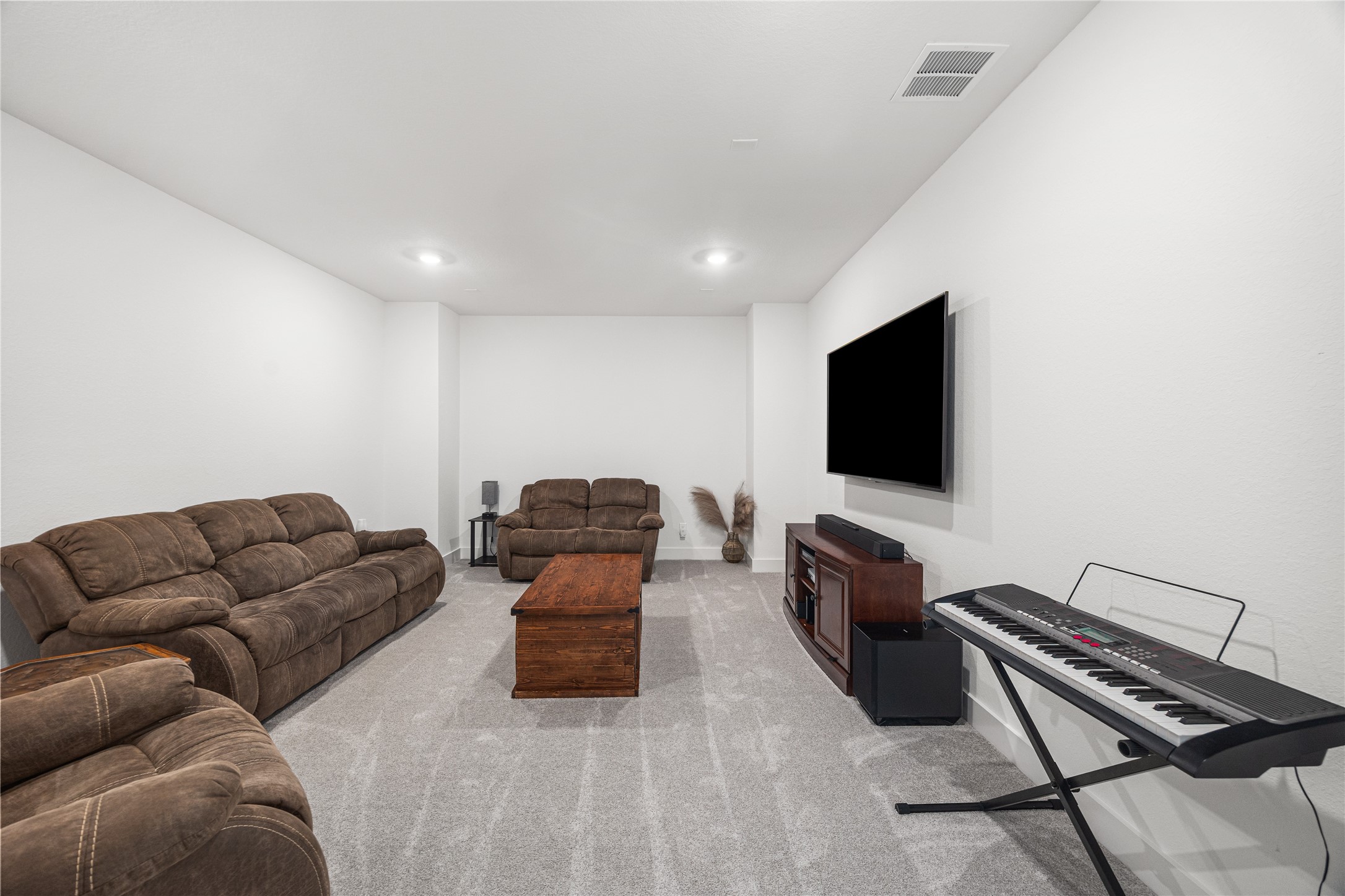 Versatile media room designed to adapt to your familys lifestyleperfect for movie nights, gaming, or creating your own private retreat.
