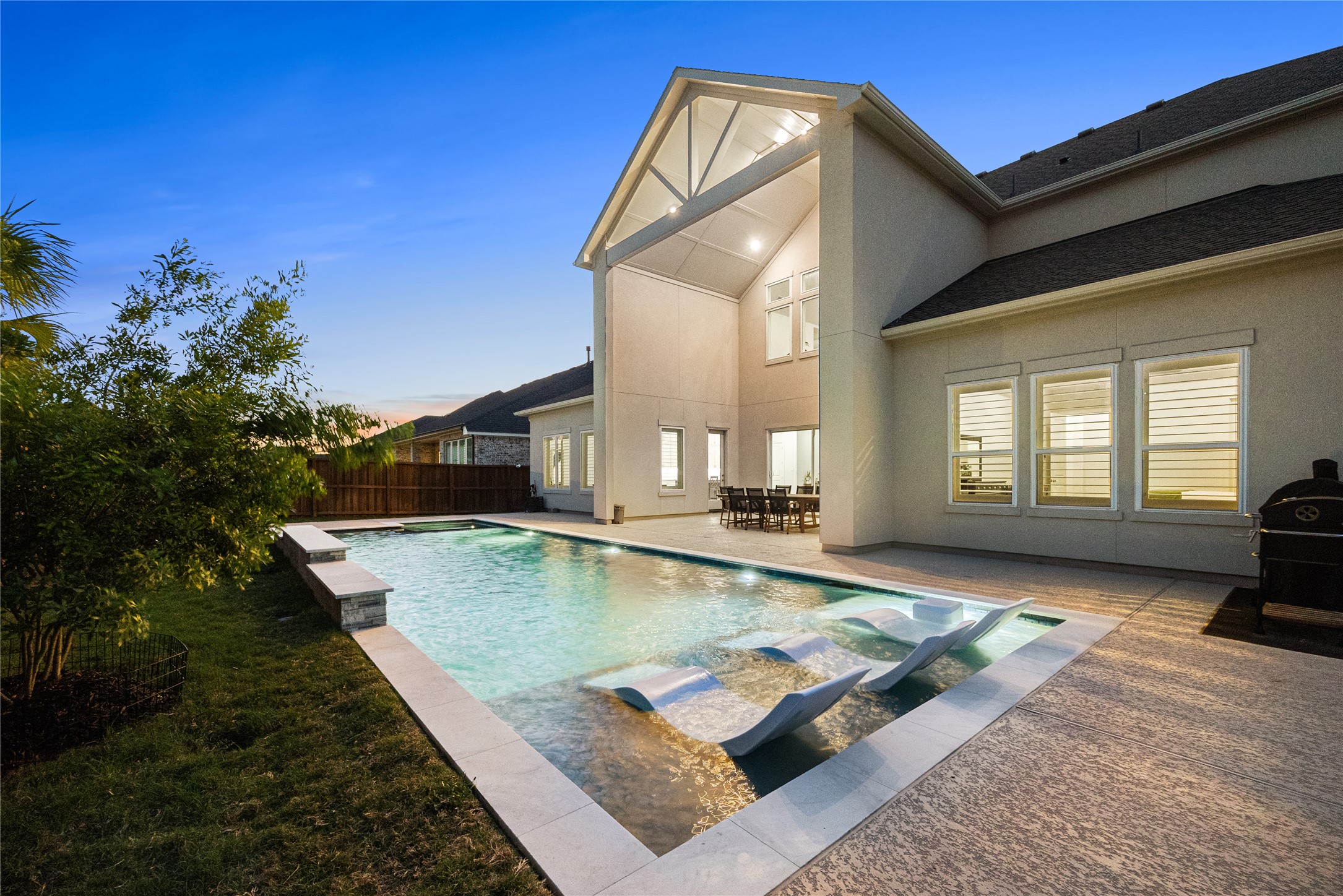 Sports pool with tanning ledge and spa.