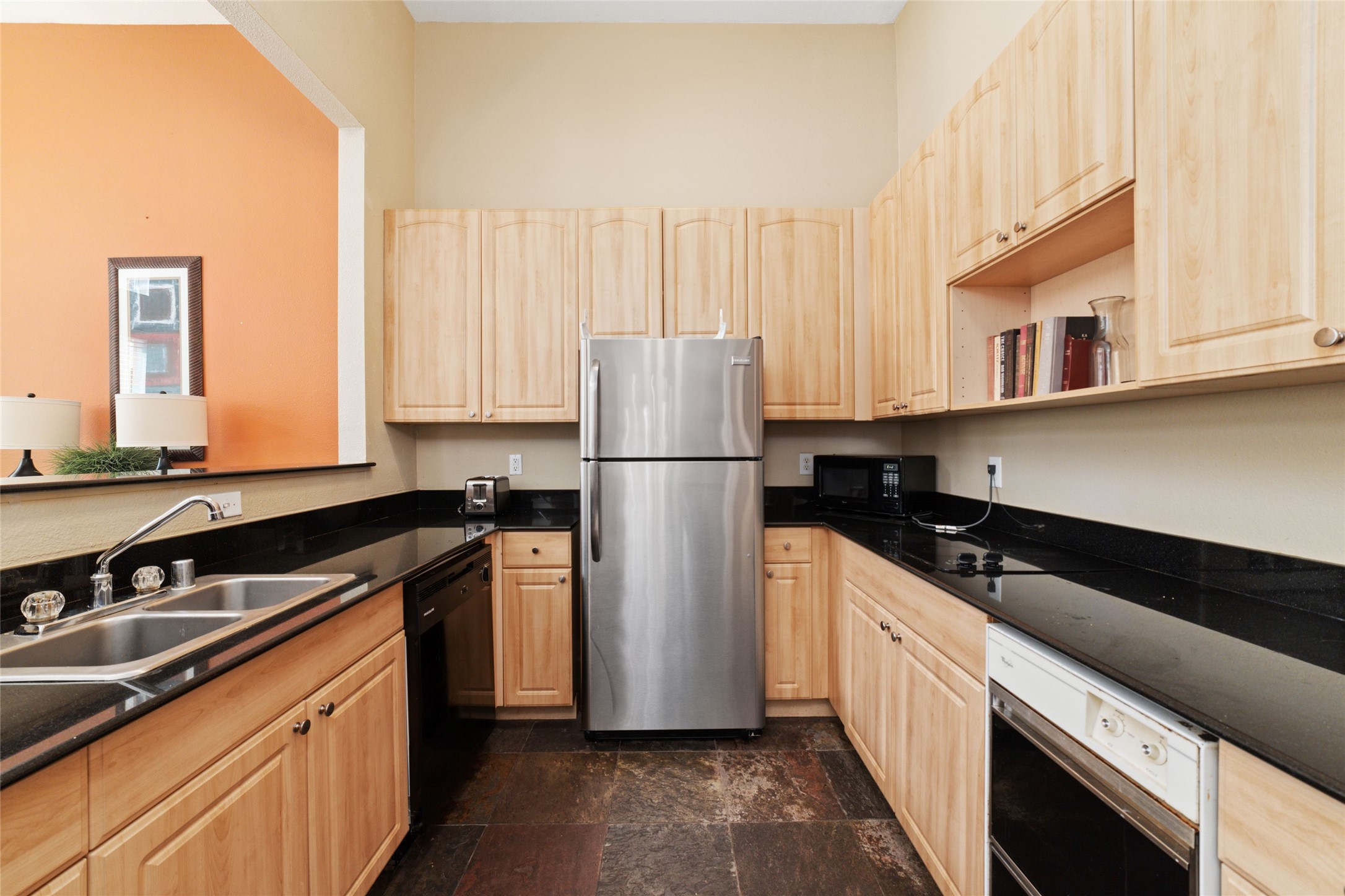 Enjoy the clubhouse amenities with comfortable lounge spaces, a kitchen area, and plenty of room to unwind.