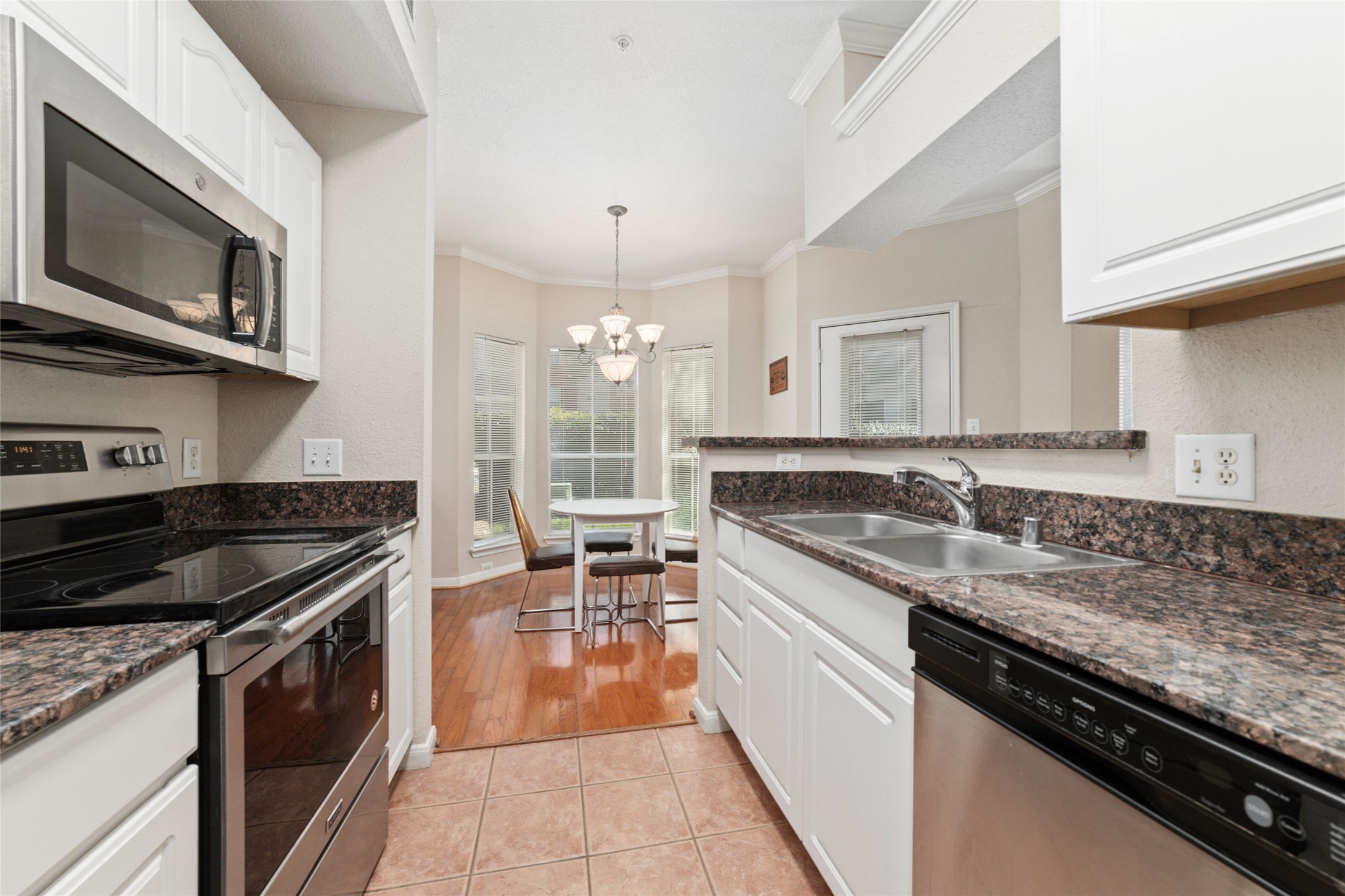 Gourmet Kitchen  Granite countertops, stainless steel appliances, and ample cabinet space make cooking a breeze.