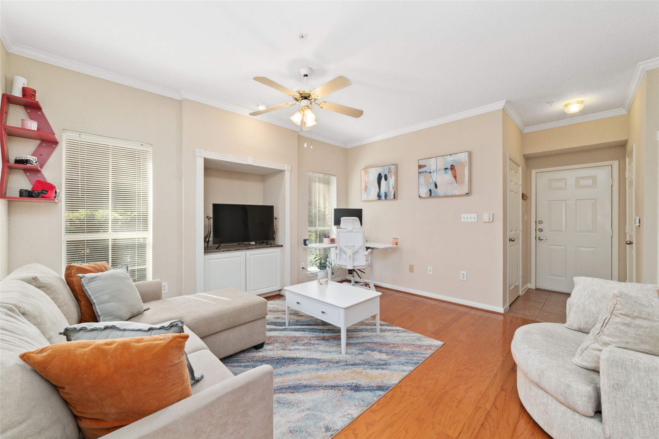 Spacious Living Area  High ceilings, gleaming hardwood floors, and tons of natural light make this space feel bright and open.