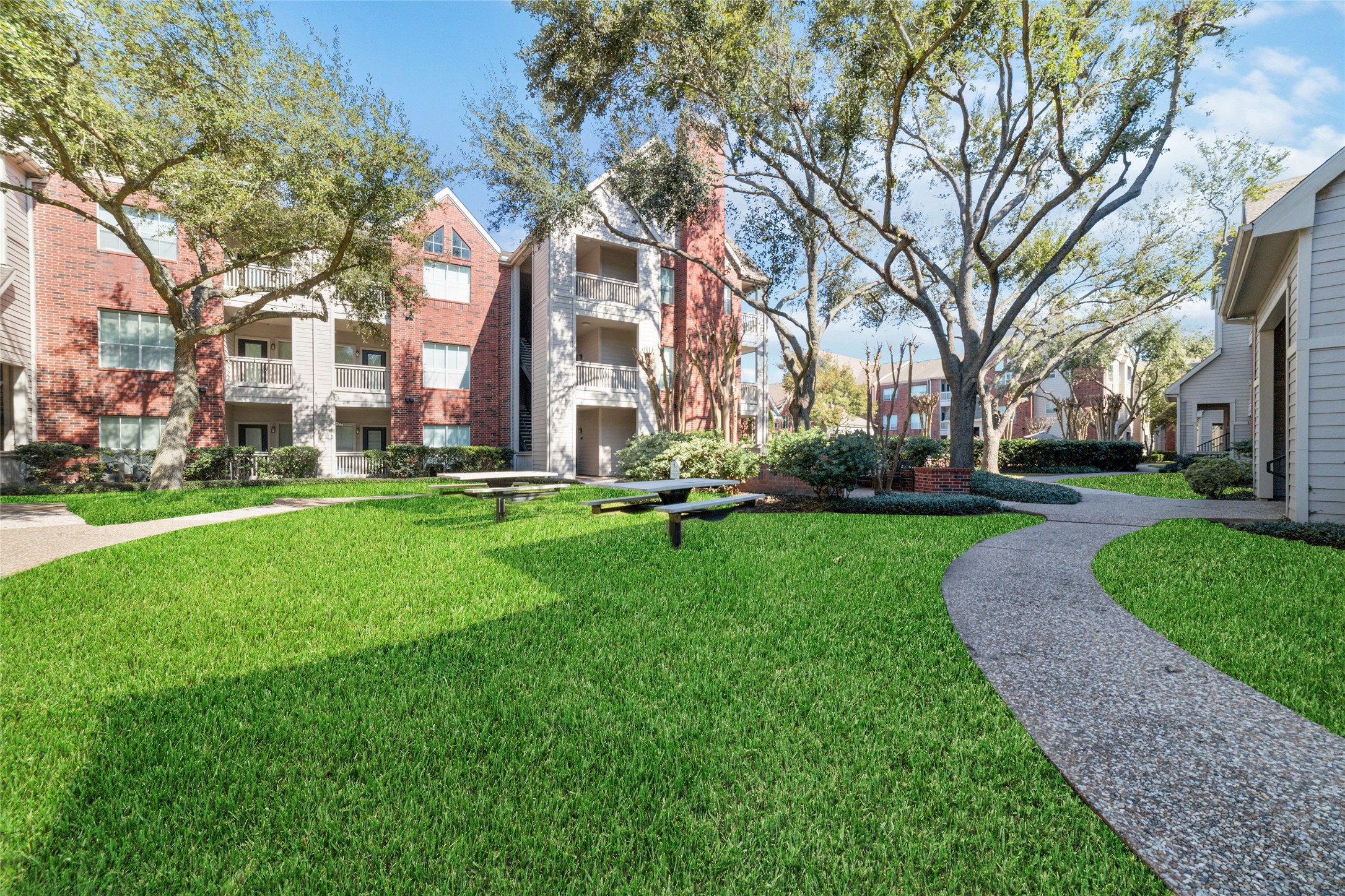 Lush Landscaping  Beautifully maintained grounds create a tranquil and inviting atmosphere.