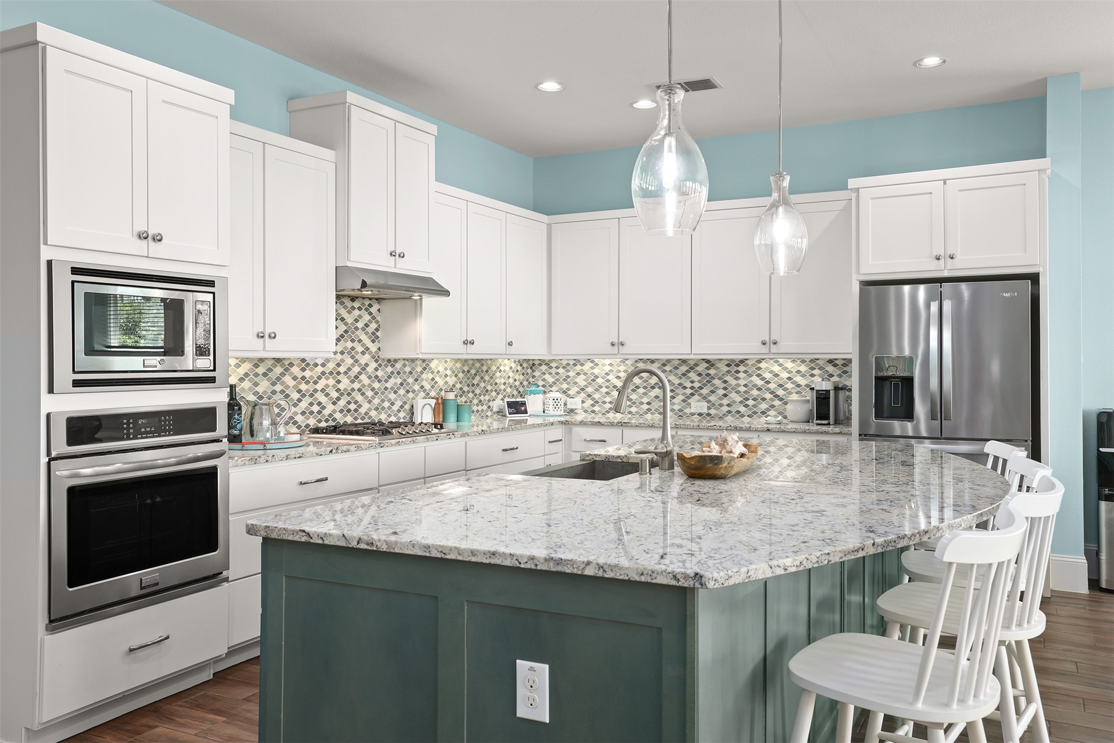 Kitchen with granite counters and a huge kitchen island. Kitchen with granite counters and a huge kitchen island.