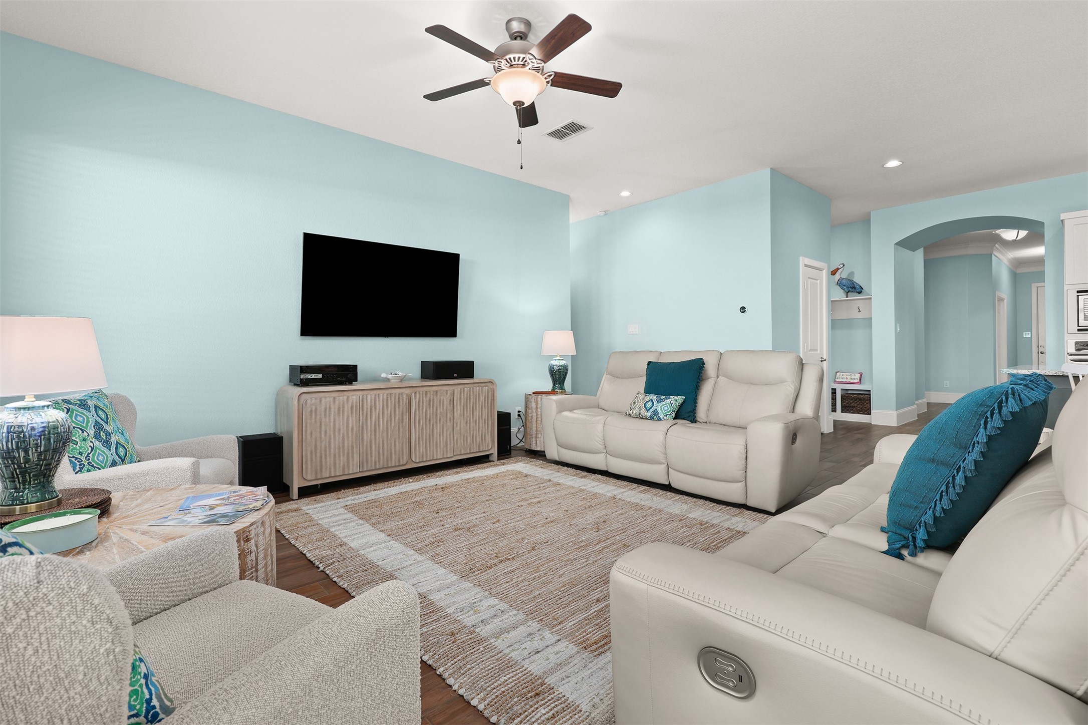 Another view of the family room. Primary room entry is to the right of the T.V.