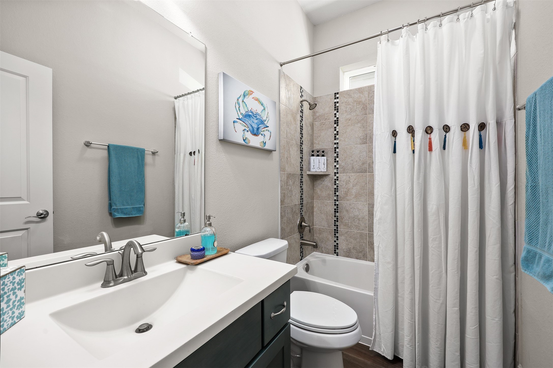Full bath located between bedroom 2 and 3.