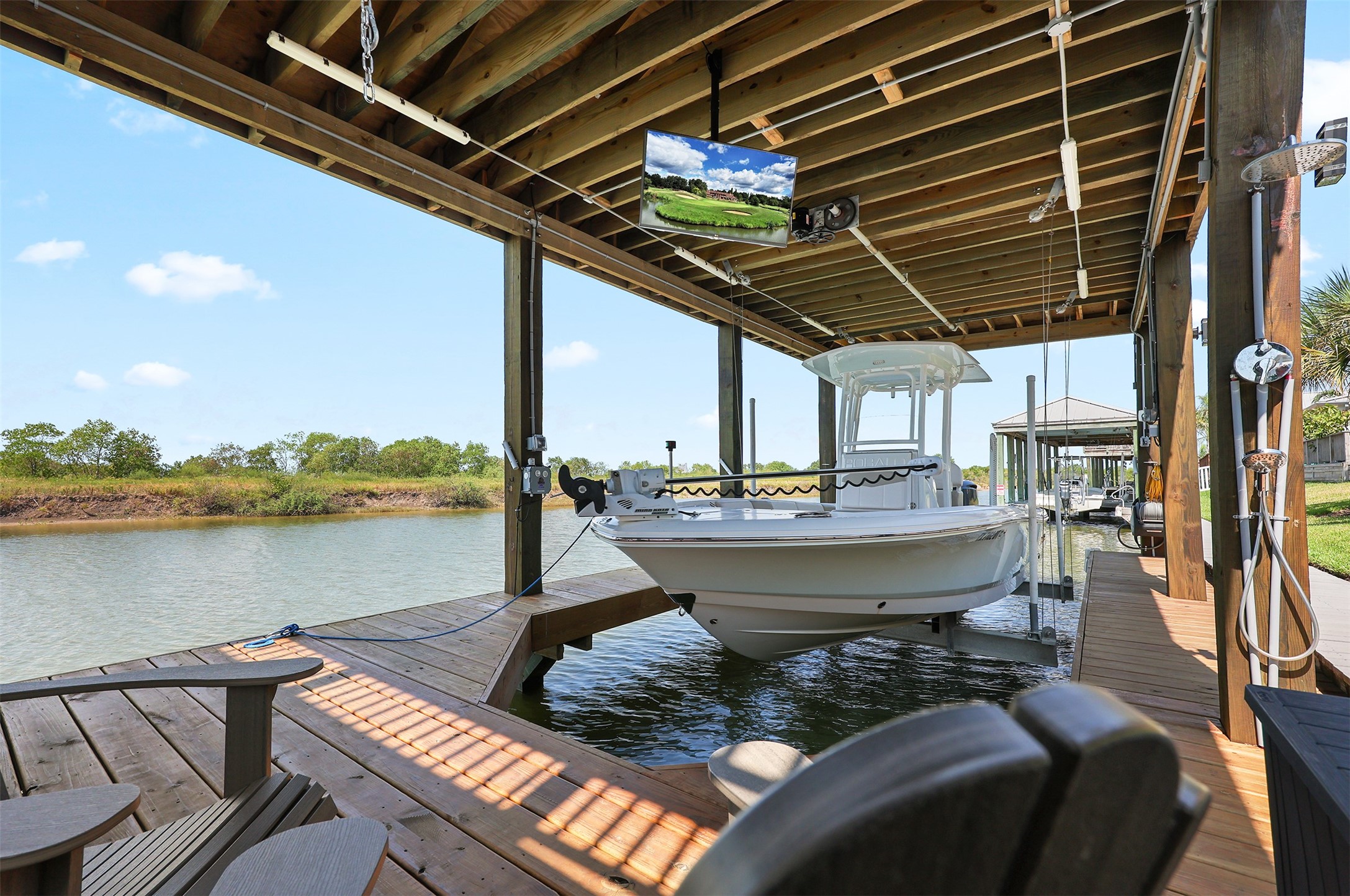 36' Boathouse was installed in 2025.  Notice the television and chairs for relaxing by the water.
