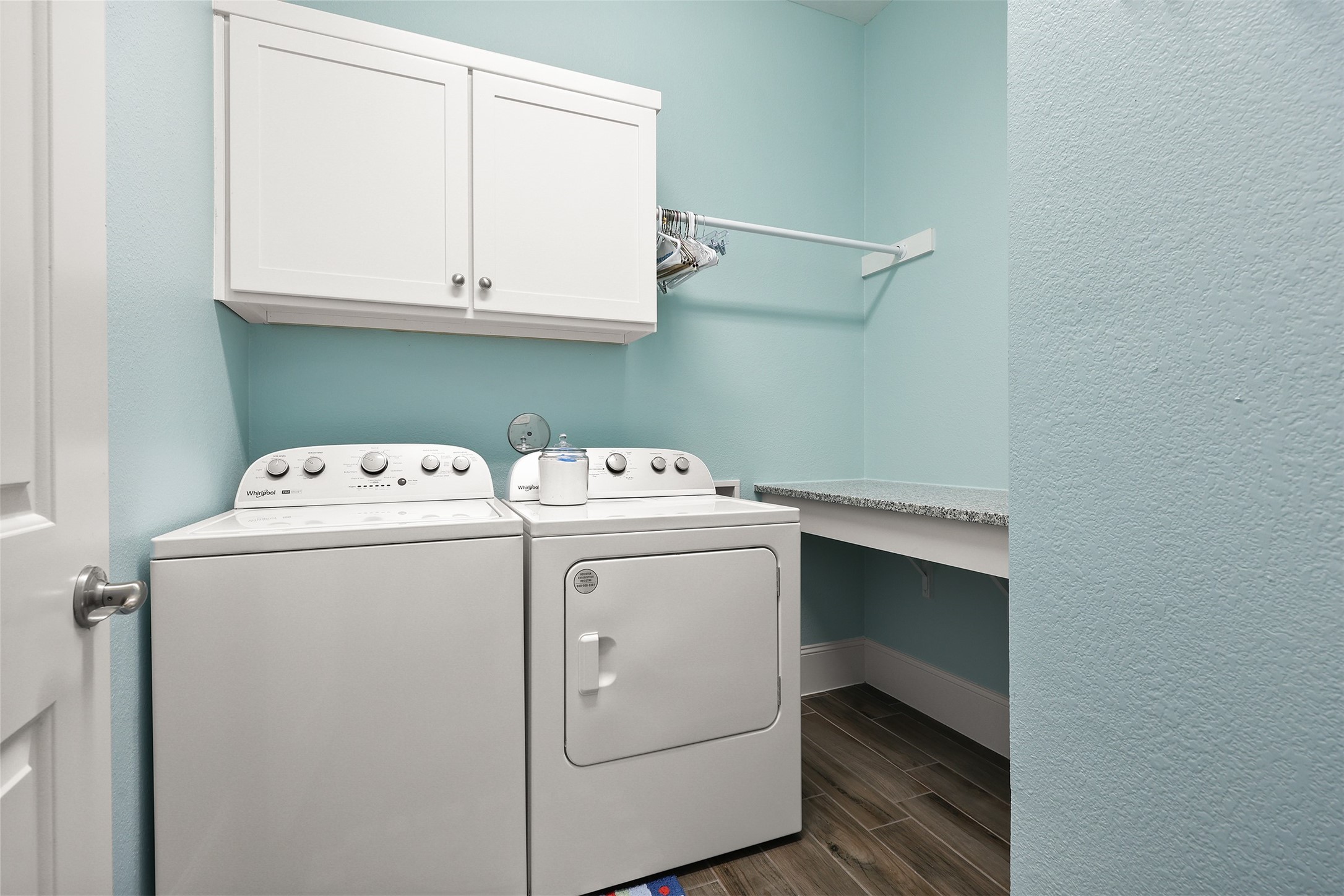 Counter space and cabinets in the utility room.