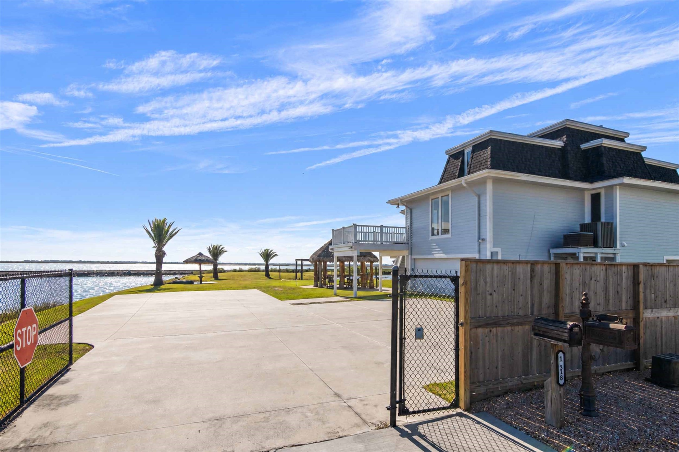A private gate provides added privacy. Experience the best of coastal living in one of Bayou Vista's most distinctive  waterfront properties.