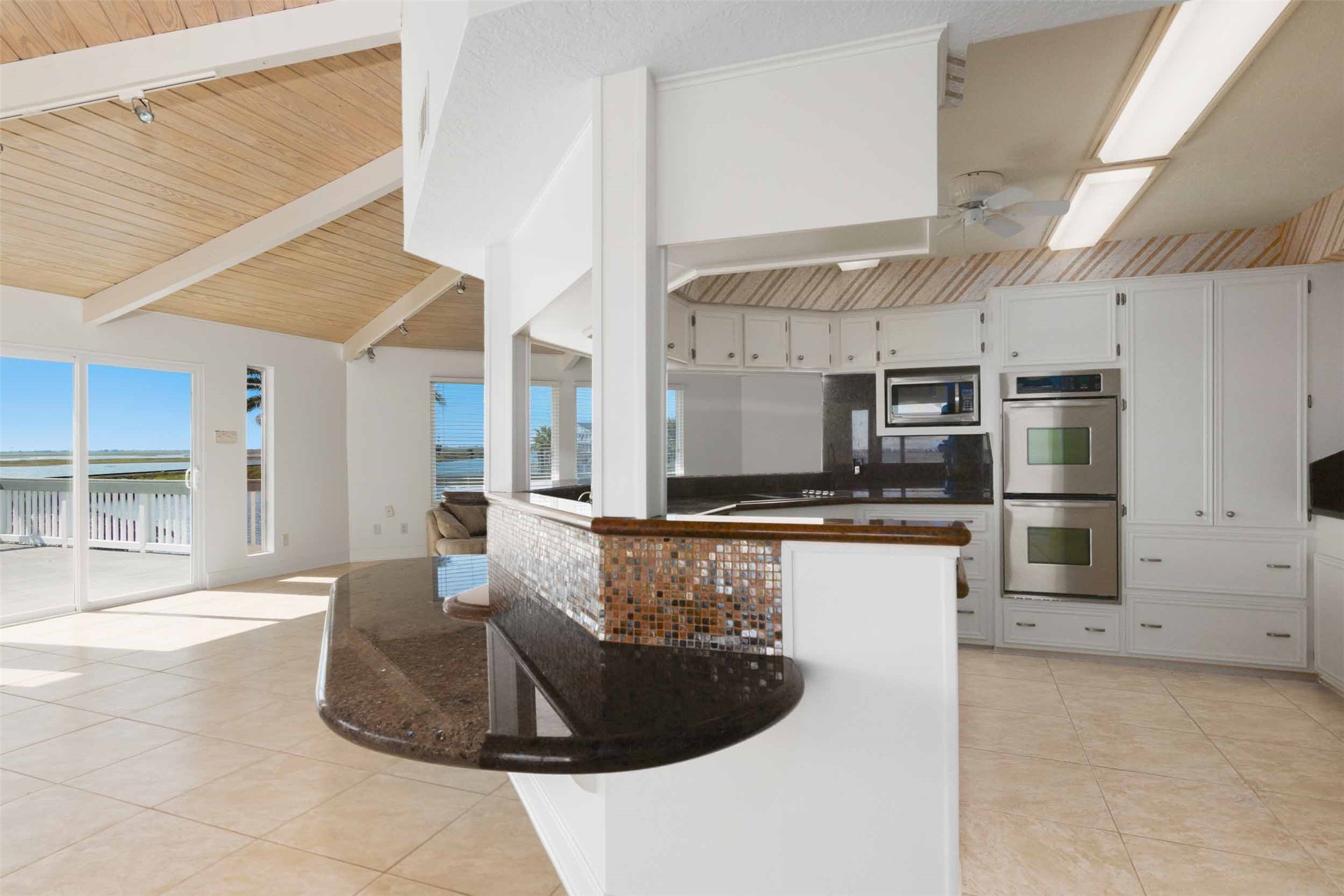 Living room, kitchen and bar.