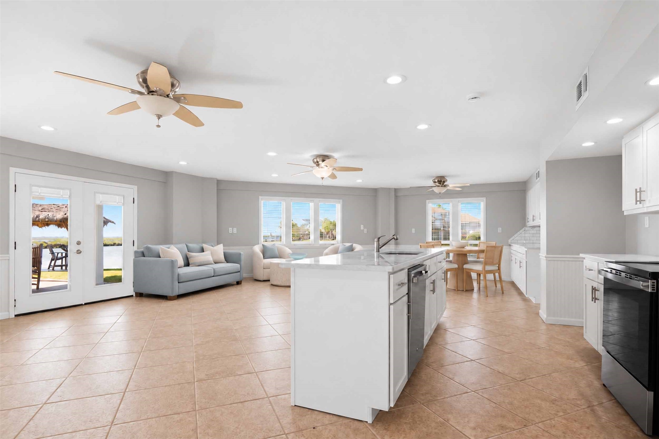 Updated gorgeous living room, dining room and kitchen downstairs. French doors and wall of windows.