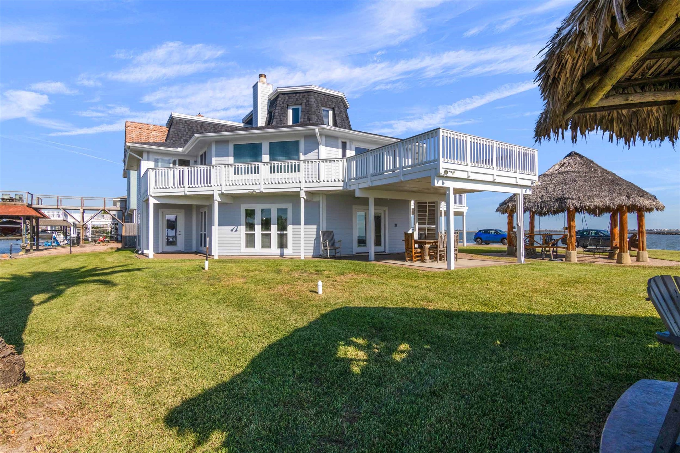 This home is designed for entertainment with 3 living areas,2 kitchens, 3 palapas and large decks.