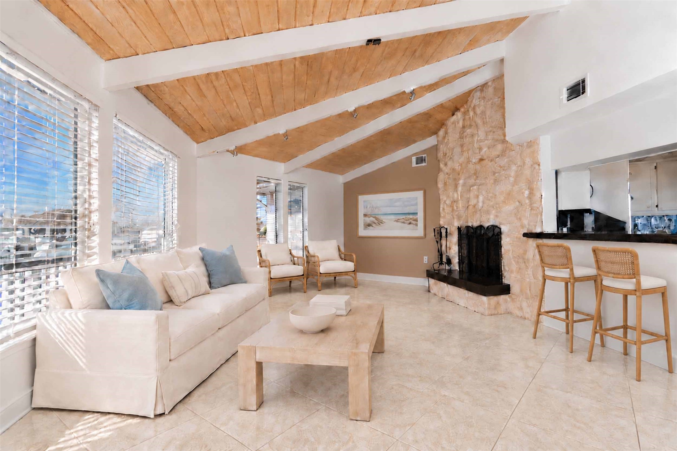 Wonderful fireplace in living room and bar.