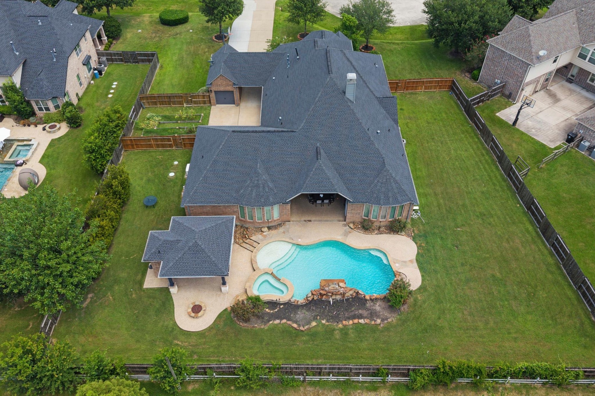The long side yard near the pool might be a great spot for play equipment or even a dog run.