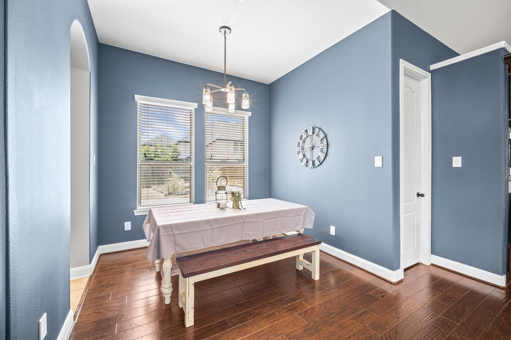 A charming breakfast room rests near the kitchen on the opposite side and offers a lovely outdoor view.