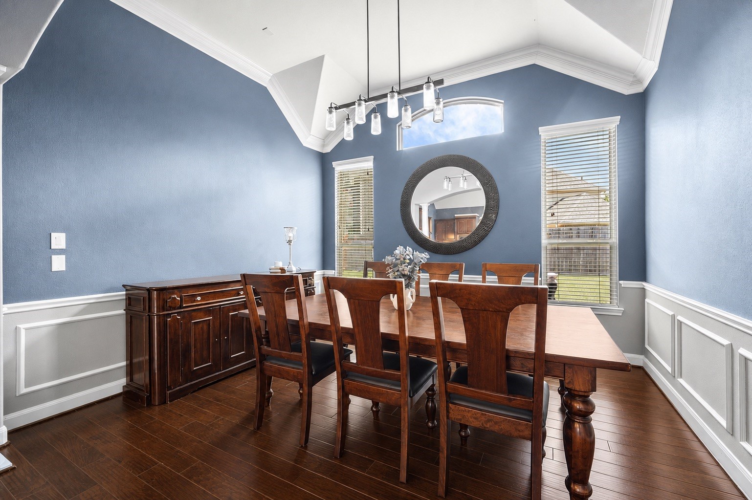 Elegant and welcoming, this formal living room is located near the kitchen for easy dinner service.