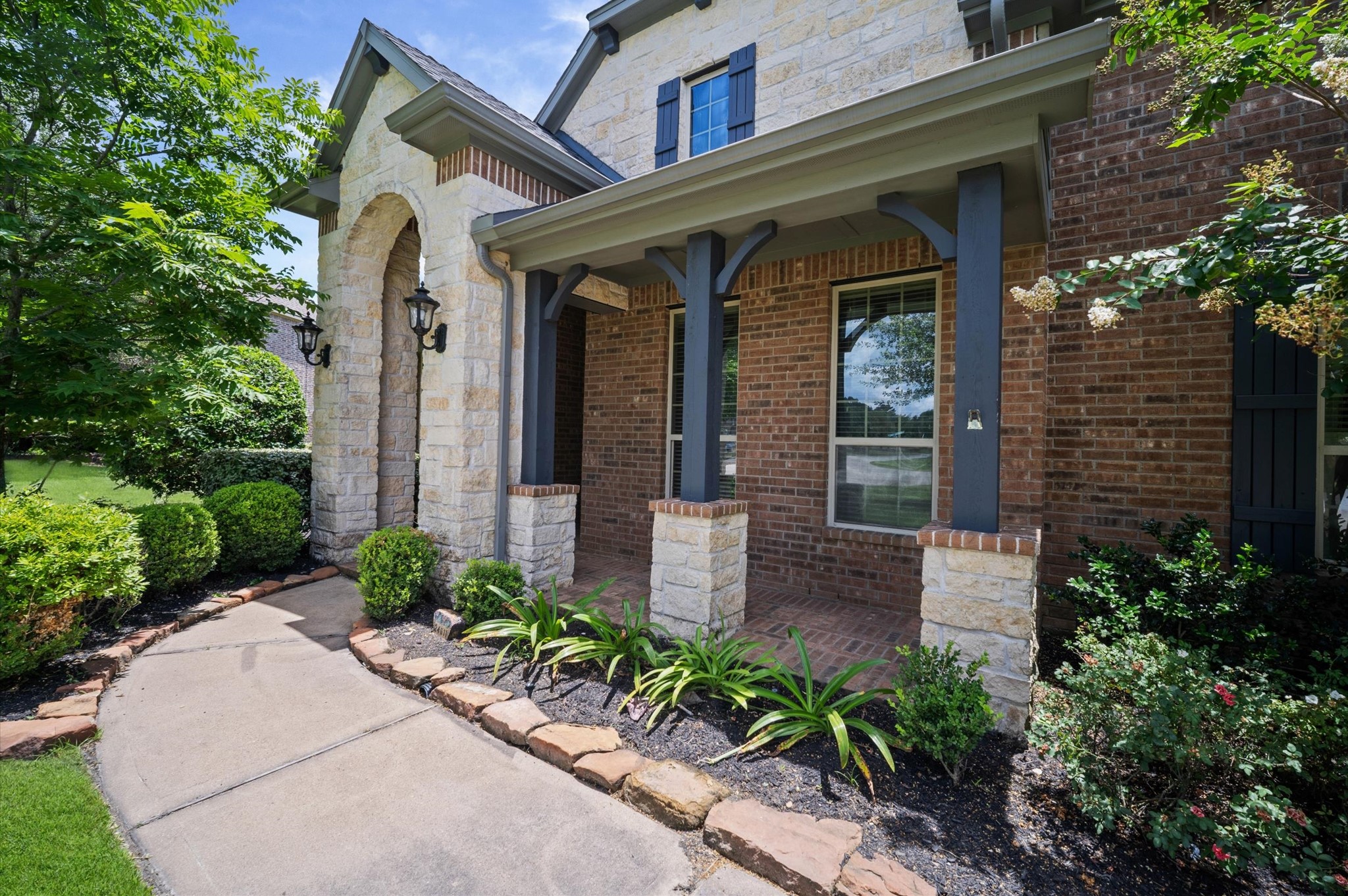 Who doesn't love a covered front porch!? Add a few chairs and you'll have a shady spot to read your favorite book or welcome your visitors.
