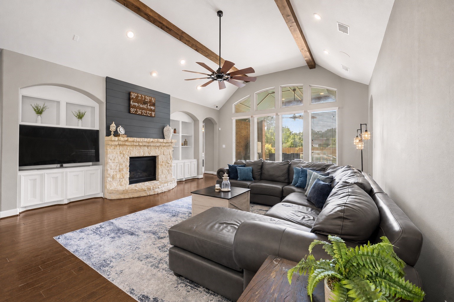 Step into this inviting living room that rests under a vaulted ceiling. Enjoy the backyard view by day or cozy up to the gas fireplace on a cool evening.