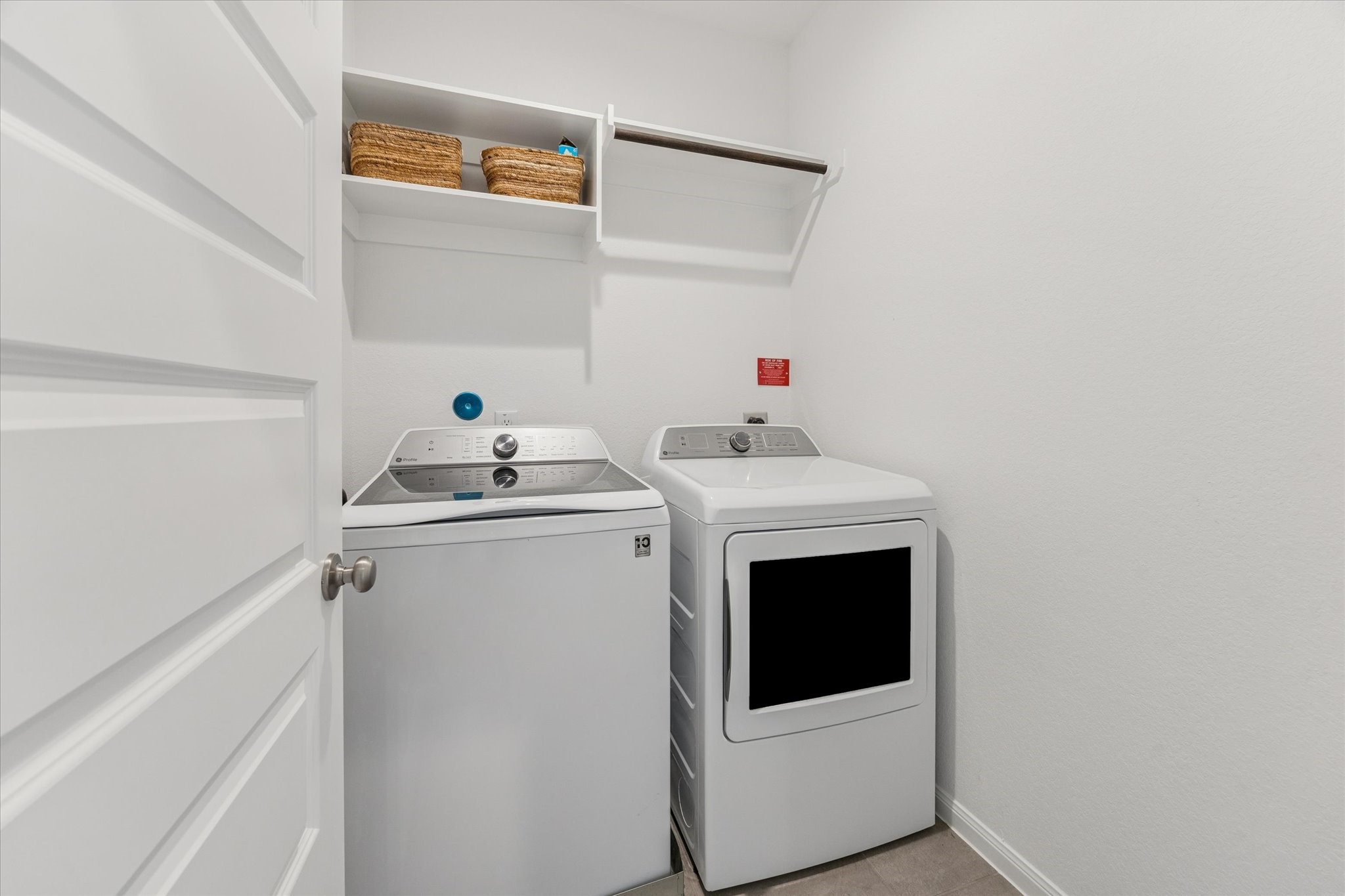 Spacious laundry room with built-in storage and easy access.