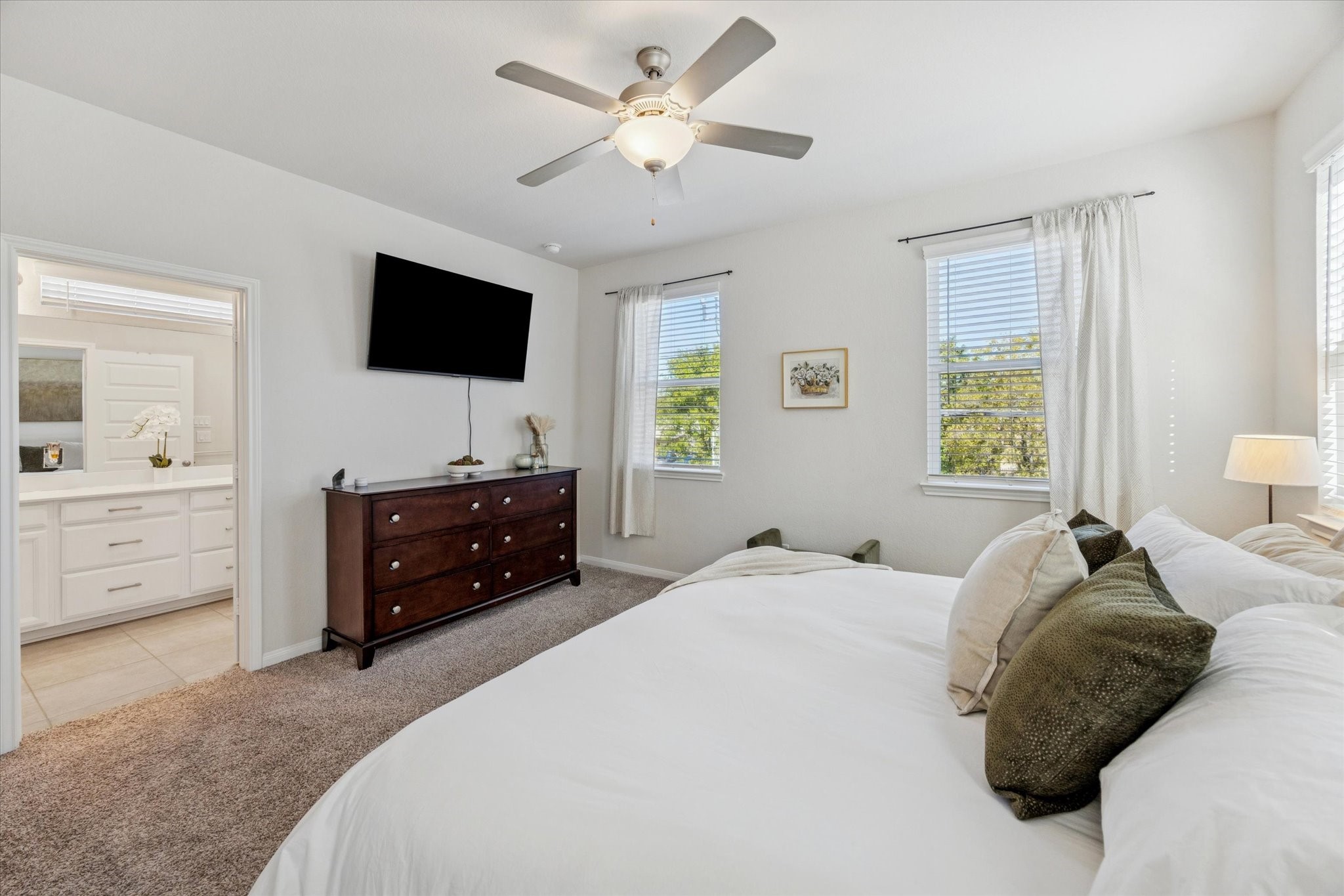 A serene primary suite designed for rest and relaxation.