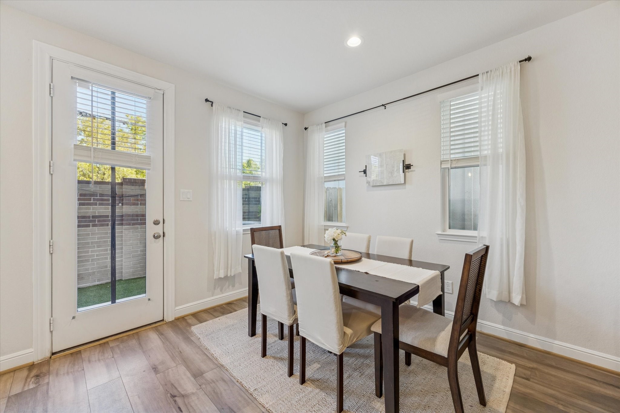 Bright, inviting dining area with room for everyone at the table. Bright, inviting dining area with room for everyone at the table.