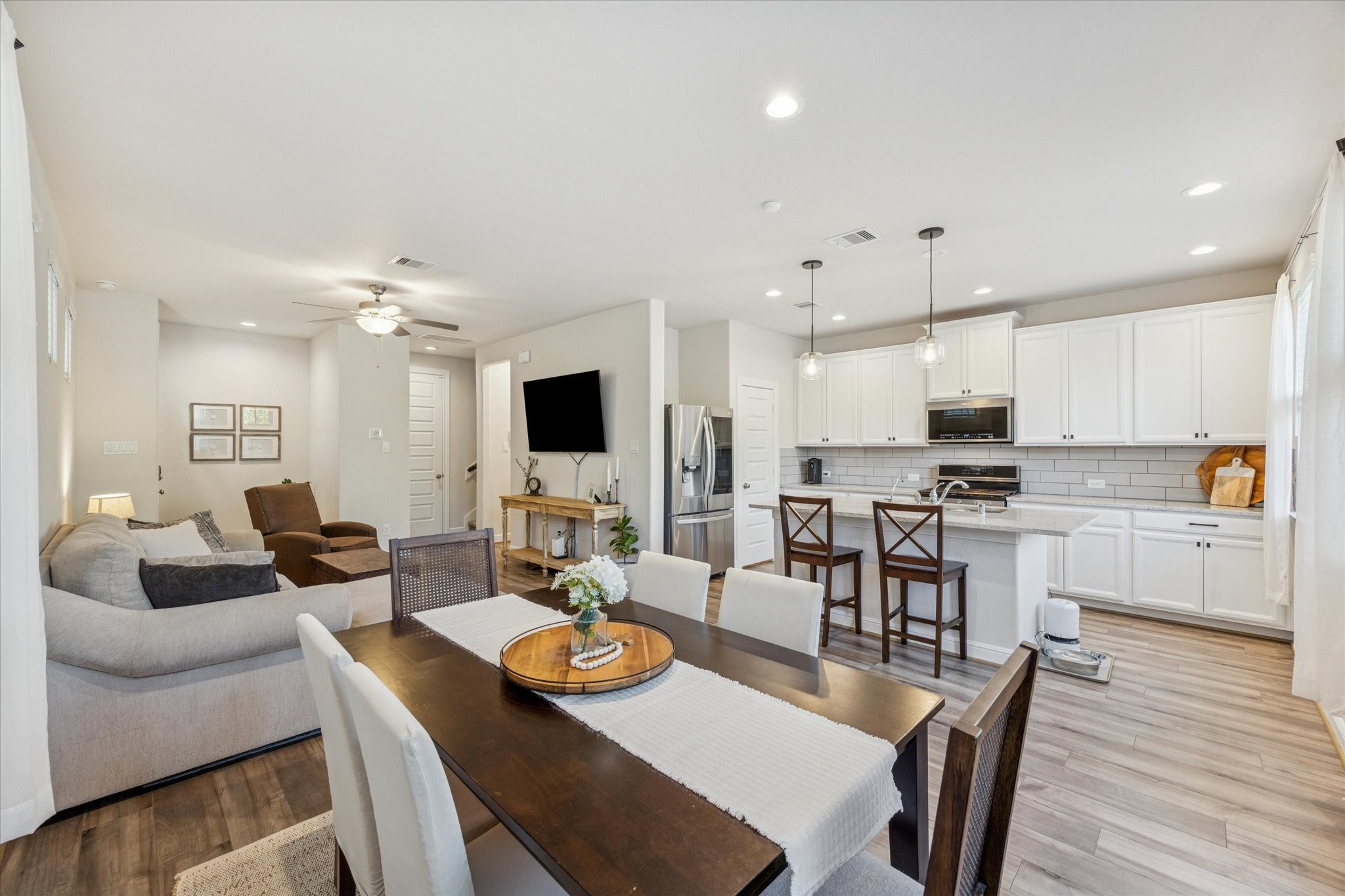 Open-concept design creates a seamless flow from living to dining.
