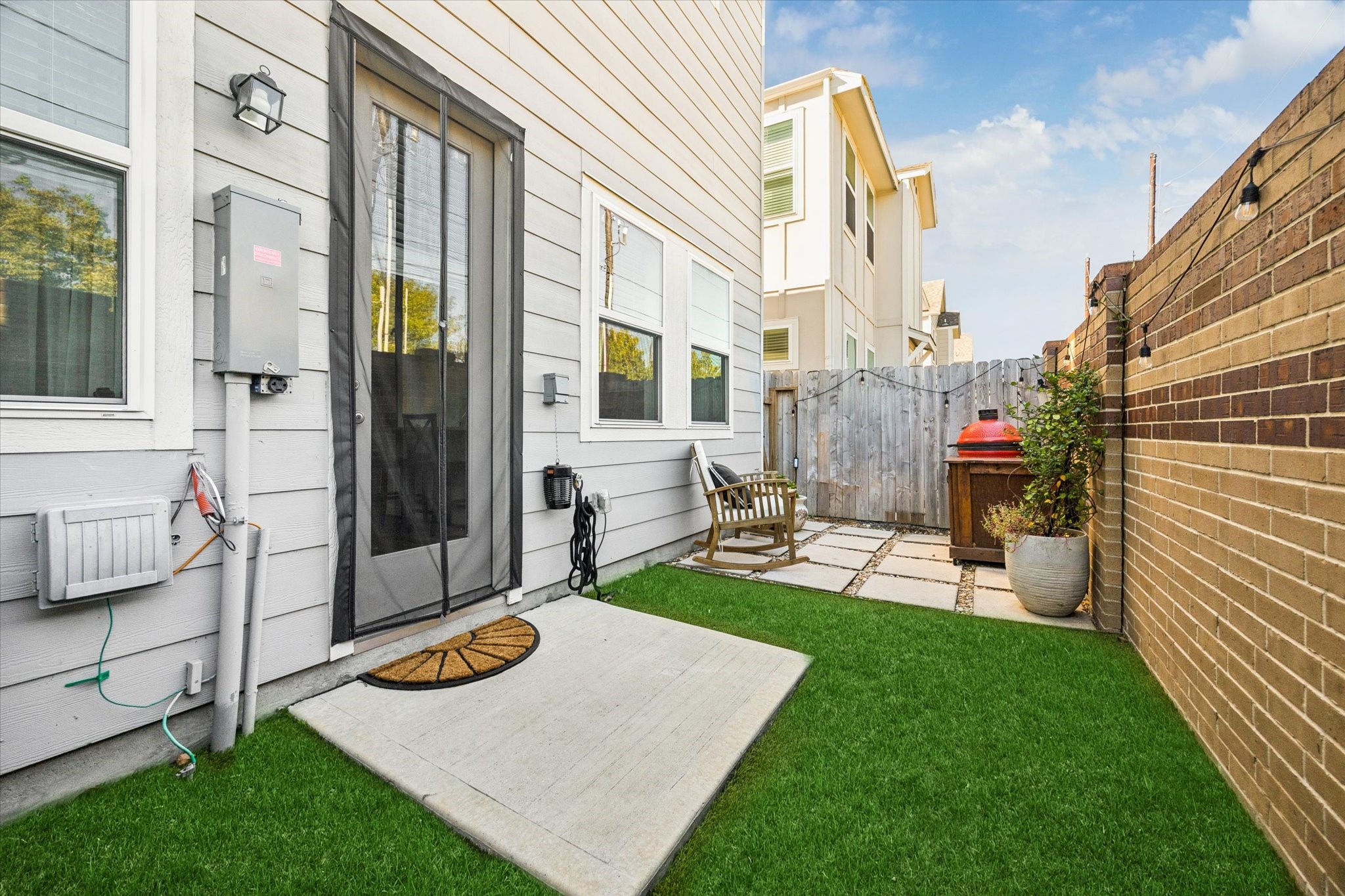 Note the portable generator plug at the breaker box. The perfect outdoor space for gatherings or quiet mornings.