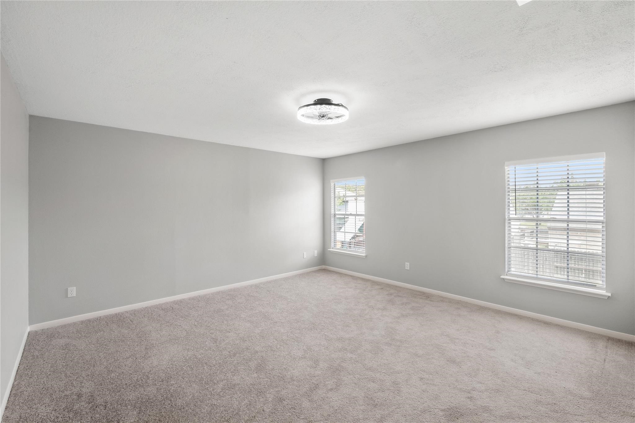 The spacious upstairs primary bedroom offers plenty of room to create your own private retreat, complete with large windows that fill the space with natural light. The spacious upstairs primary bedroom offers plenty of room to create your own private retreat, complete with large windows that fill the space with natural light.