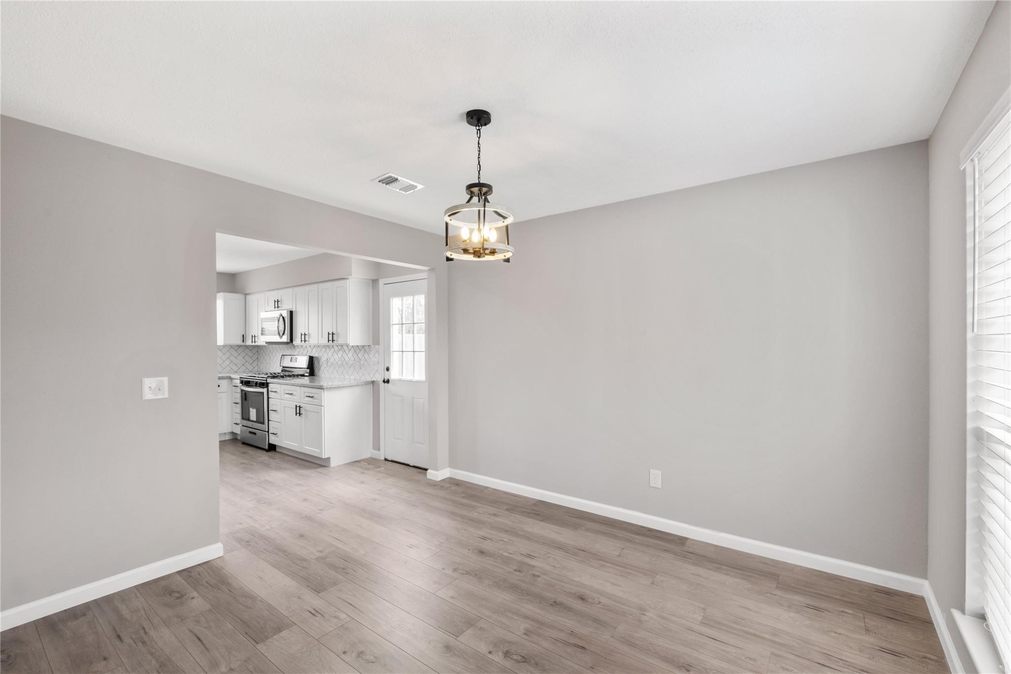 Directly across from the entry is the formal dining room, with access to the kitchen just beyond. Directly across from the entry is the formal dining room, with access to the kitchen just beyond.