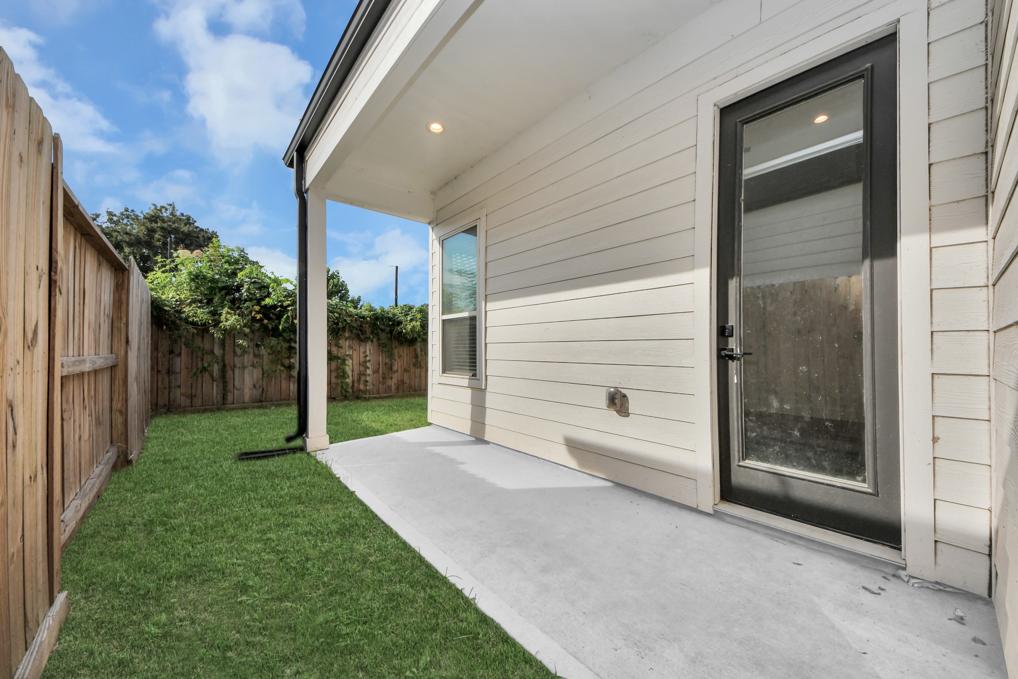Patio area with enough space for outdoor furniture for lounging.